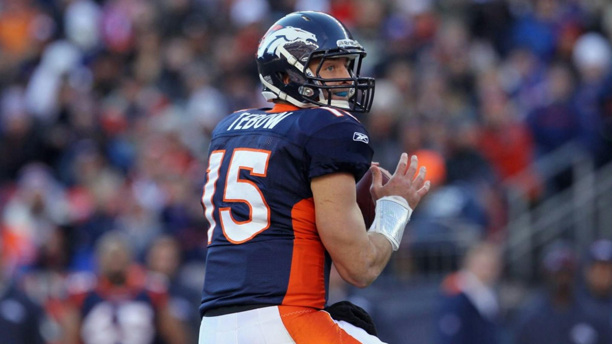 Tim Tebow Quarterback Tim Tebow #15 of the Denver Broncos drops back to pass during the AFC Wild Card Playoff game at Sports Authority Field against the Pittsburgh Steelers at Mile High on January 8, 2012 in Denver, Colorado.