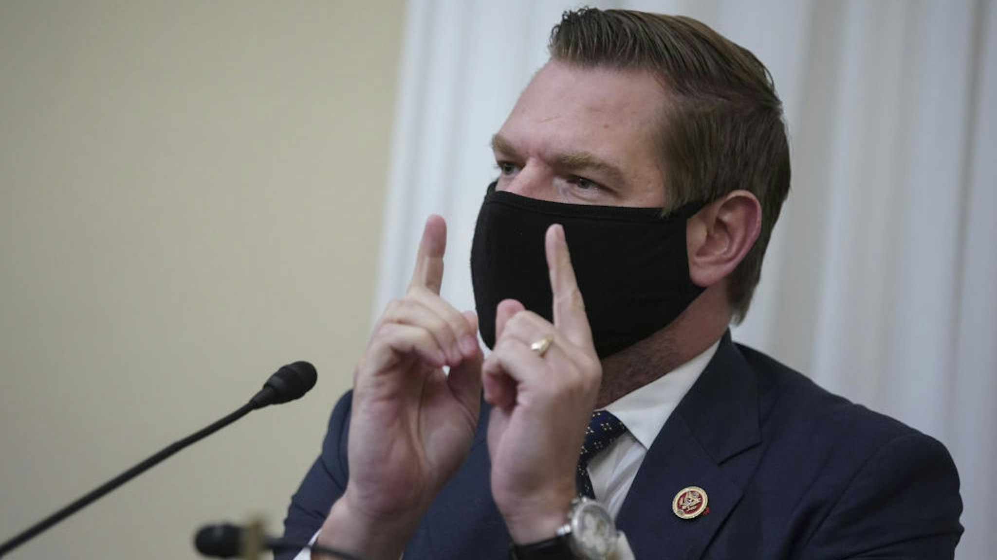 Representative Eric Swalwell, a Democrat from California, wears a protective mask while speaking during a House Intelligence Committee hearing in Washington, D.C., U.S., on Thursday, April 15, 2021. The hearing follows the release of an unclassified report by the intelligence community detailing the U.S. and its allies will face "a diverse array of threats" in the coming year, with aggression by Russia, China and Iran. Photographer: Al Drago/Bloomberg