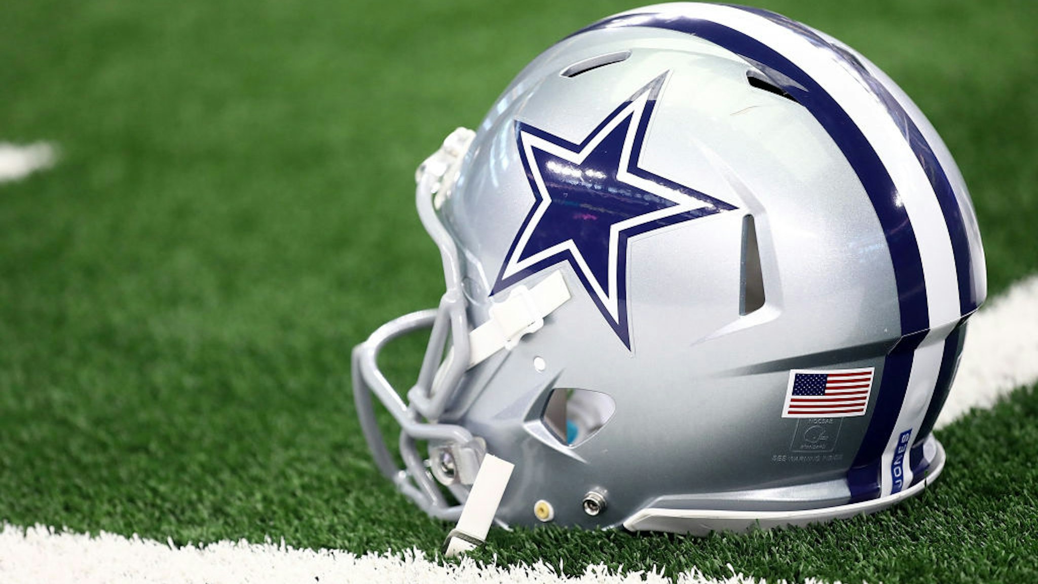 ARLINGTON, TX - OCTOBER 14: A Dallas Cowboys helmet at AT&amp;T Stadium on October 14, 2018 in Arlington, Texas.
