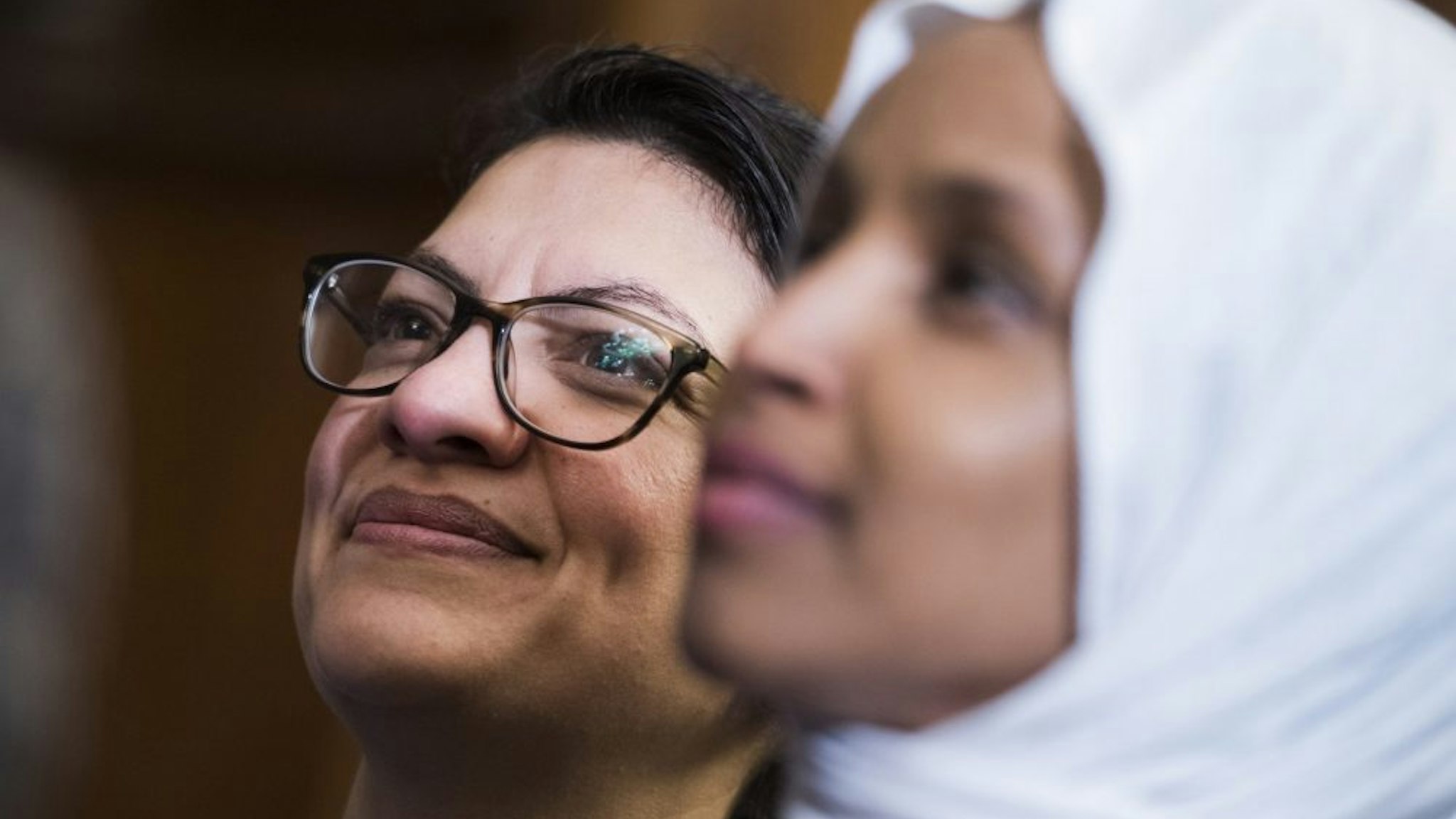 UNITED STATES - MARCH 13: Reps. Ilhan Omar, D-Minn., right, and Rashida Tlaib, D-Mich., attend a rally with Democrats in the Capitol to introduce the "Equality Act," which will amend existing civil rights legislation to bar discrimination based on gender identification and sexual orientation on Wednesday, March 13, 2019.