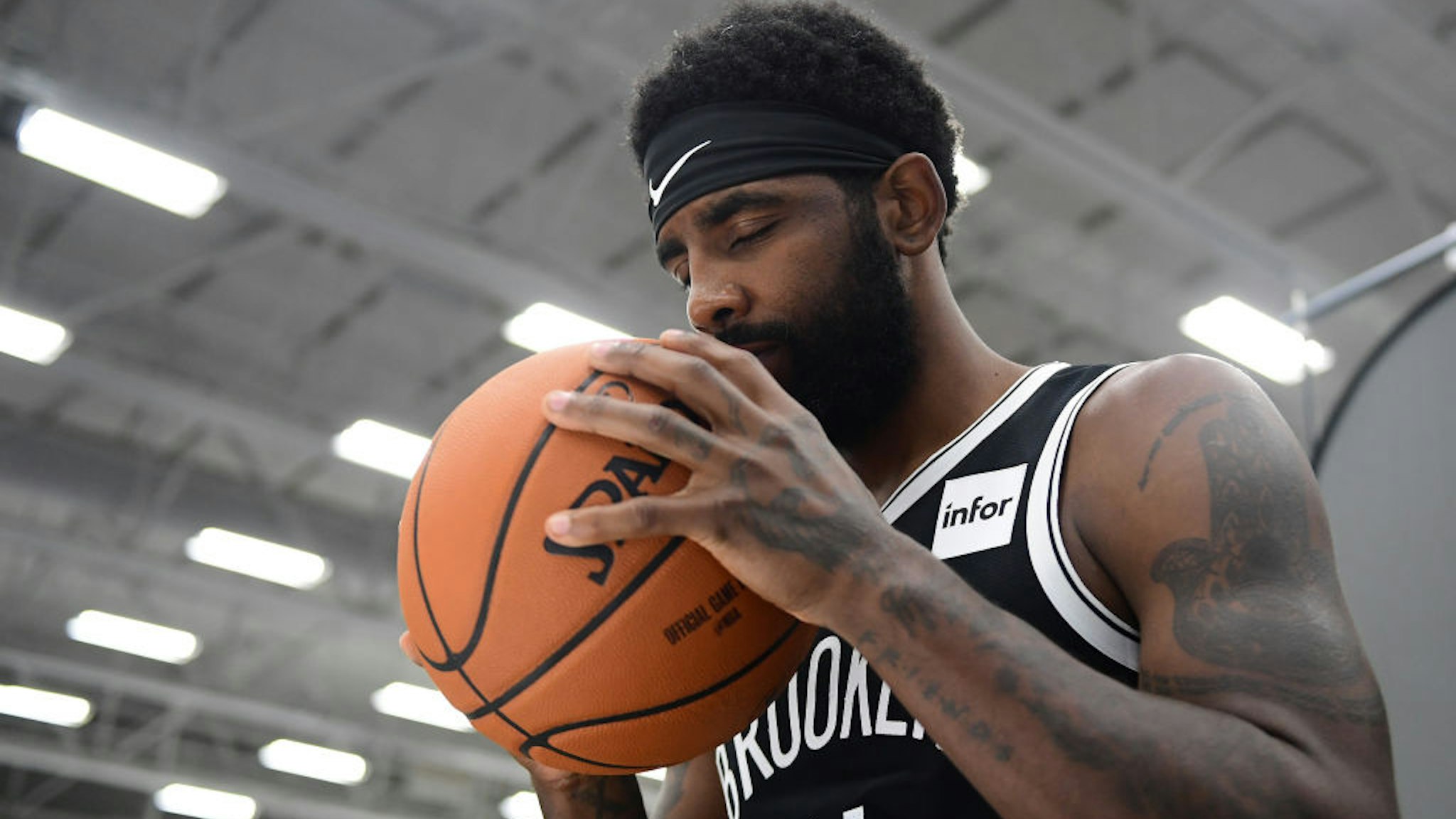 NEW YORK, NEW YORK - SEPTEMBER 27: Kyrie Irving #11 of the Brooklyn Nets poses for a photograph during Media Day at HSS Training Center on September 27, 2019 in the Brooklyn borough of New York City. NOTE TO USER: User expressly acknowledges and agrees that, by downloading and or using this photograph, User is consenting to the terms and conditions of the Getty Images License Agreement. (Photo by Emilee Chinn/Getty Images)