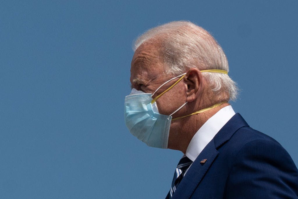 Democratic Presidential Candidate Joe Biden wears two masks as he arrives in Fort Lauderdale, Florida on October 13, 2020. - Joe Biden headed for Florida on Tuesday to court elderly Americans who helped elect Donald Trump four years ago but appear to be swinging to the Democratic candidate for the White House this time around amid the coronavirus pandemic. Biden, at 77 the oldest Democratic nominee ever, is to deliver his vision for older Americans at an event in the city of Pembroke Pines, north of Miami, his campaign said. (Photo by JIM WATSON / AFP) (Photo by JIM WATSON/AFP via Getty Images)