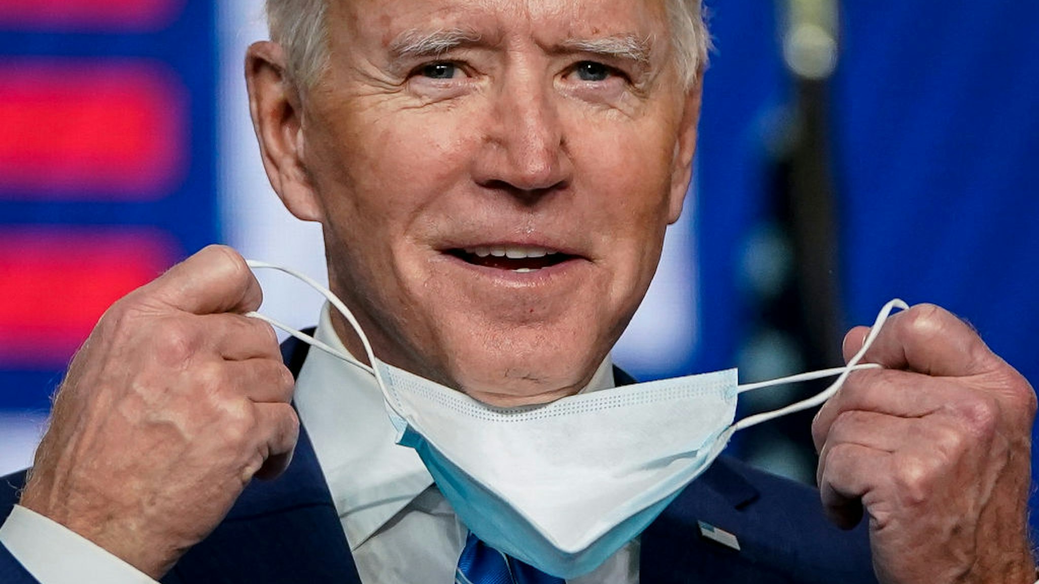 WILMINGTON, DE - NOVEMBER 04: Democratic presidential nominee Joe Biden takes his face mask off as he arrives to speak one day after America voted in the presidential election, on November 04, 2020 in Wilmington, Delaware. Biden spoke as votes are still being counted in his tight race against incumbent U.S. President Donald Trump which remains too close to call.