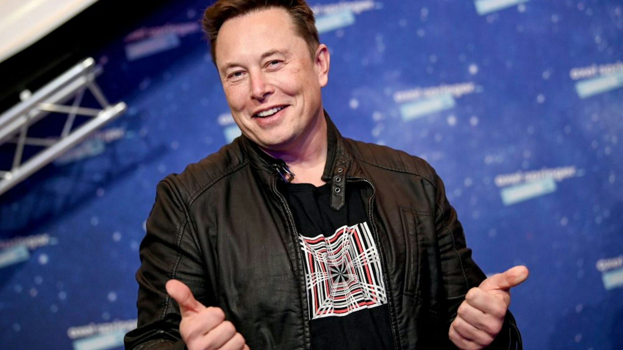 SpaceX owner and Tesla CEO Elon Musk poses as he arrives on the red carpet for the Axel Springer Awards ceremony, in Berlin, on December 1, 2020.