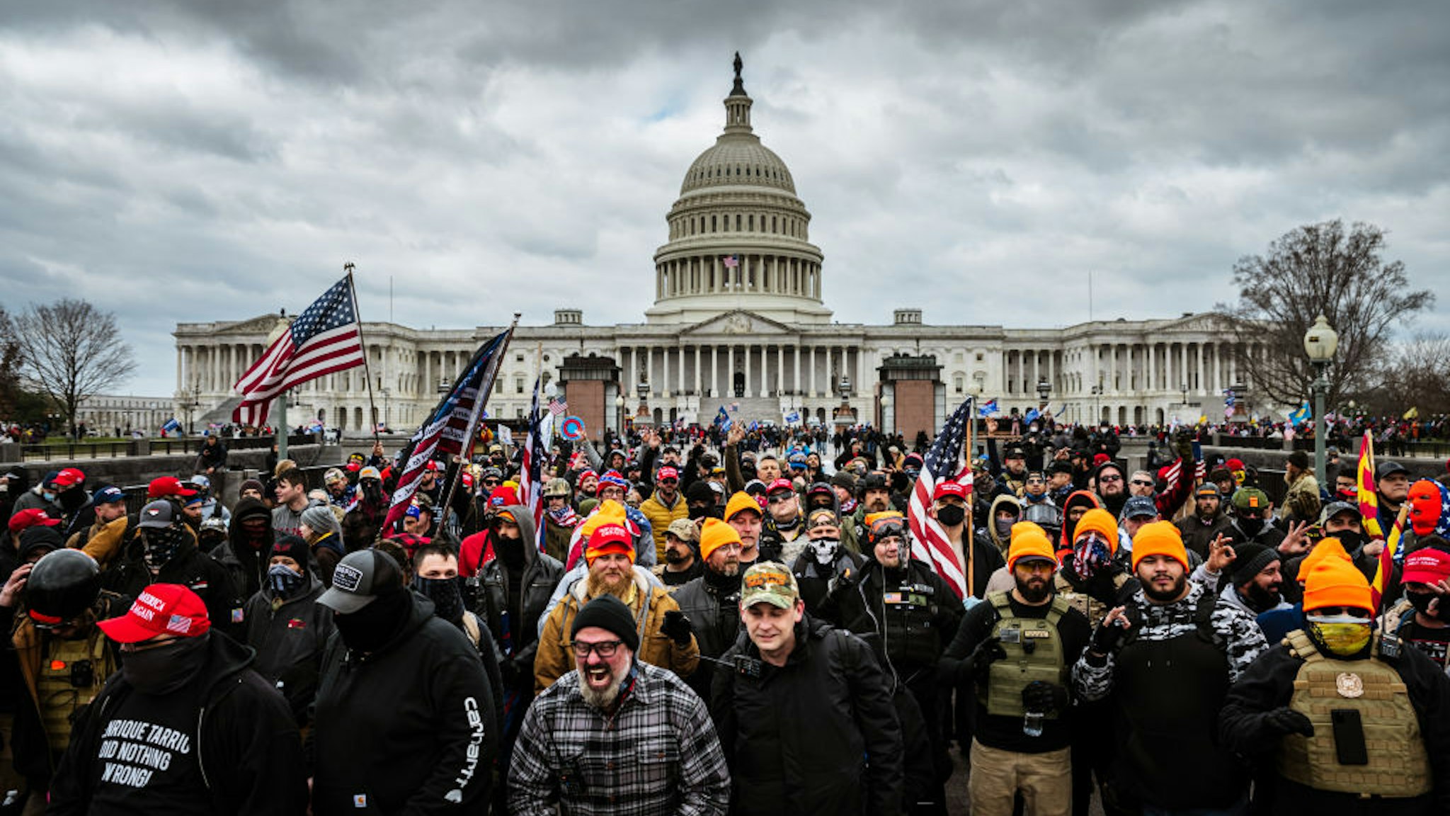 WASHINGTON, DC - JANUARY 06: Pro-Trump protesters gather in front of the U.S. Capitol Building on January 6, 2021 in Washington, DC. A pro-Trump mob stormed the Capitol, breaking windows and clashing with police officers. Trump supporters gathered in the nation's capital today to protest the ratification of President-elect Joe Biden's Electoral College victory over President Trump in the 2020 election. (Photo by Jon Cherry/Getty Images)