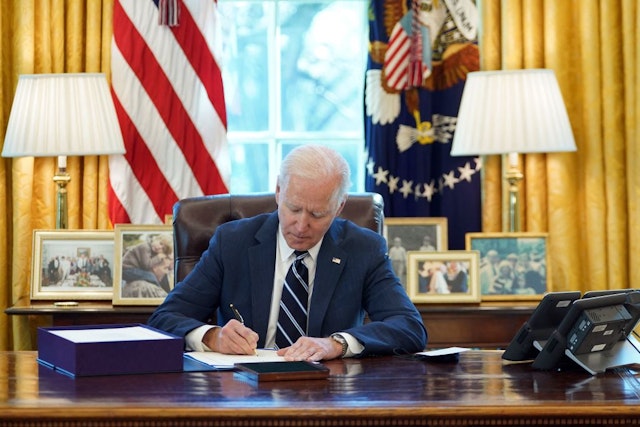 US President Joe Biden signs the American Rescue Plan on March 11, 2021, in the Oval Office of the White House in Washington, DC. - Biden signed the $1.9 trillion economic stimulus bill and will give a national address urging "hope" on the first anniversary of the start of the coronavirus pandemic. (Photo by MANDEL NGAN / AFP) (Photo by MANDEL NGAN/AFP via Getty Images)