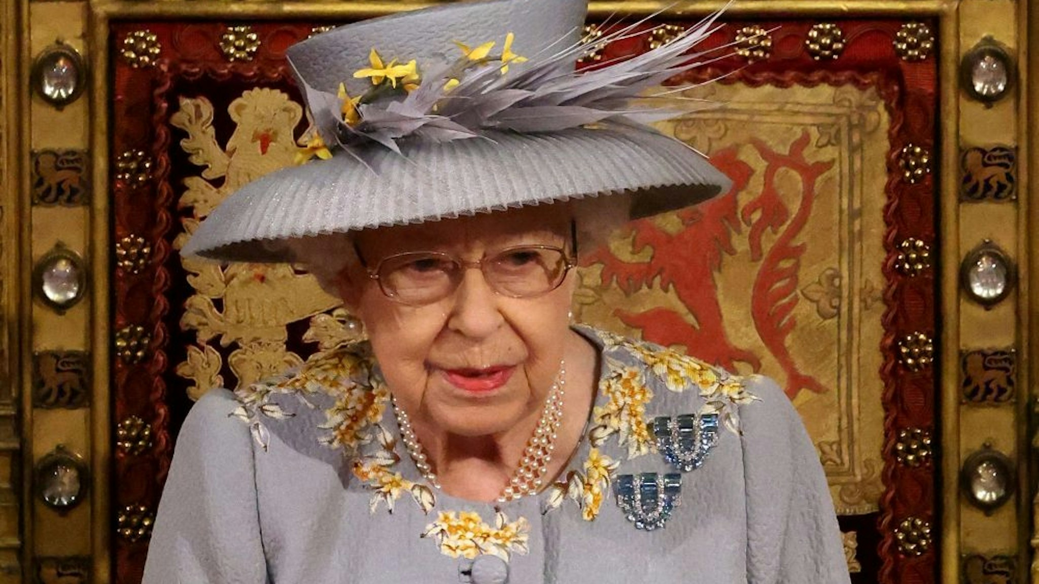 Britain's Queen Elizabeth II waits to read the Queen's Speech on the The Sovereign's Throne in the House of Lords chamber,, during the State Opening of Parliament at the Houses of Parliament in London on May 11, 2021, which is taking place with a reduced capacity due to Covid-19 restrictions. - The State Opening of Parliament is where Queen Elizabeth II performs her ceremonial duty of informing parliament about the government's agenda for the coming year in a Queen's Speech.