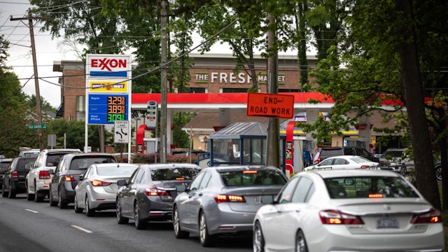 Motorists line up at an Exxon station selling gas at $3.29 per gallon soon after it's fuel supply was replenished in Charlotte, North Carolina on May 12, 2021.