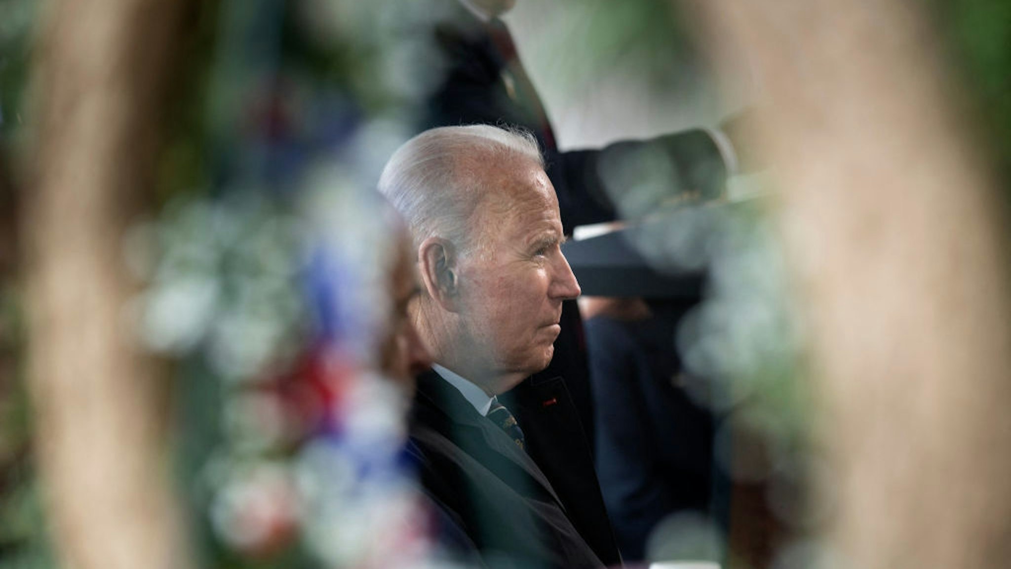 TOPSHOT - US President Joe Biden listens at Veterans Memorial Park during an annual Memorial Day Service on May 30, 2021 in New Castle, Delaware. (Photo by Brendan Smialowski / AFP) (Photo by BRENDAN SMIALOWSKI/AFP via Getty Images)