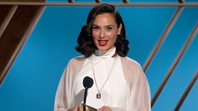 Pictured in this screengrab released on February 28, (l-r) Gal Gadot speaks onstage at the 78th Annual Golden Globe Awards broadcast on February 28, 2021.