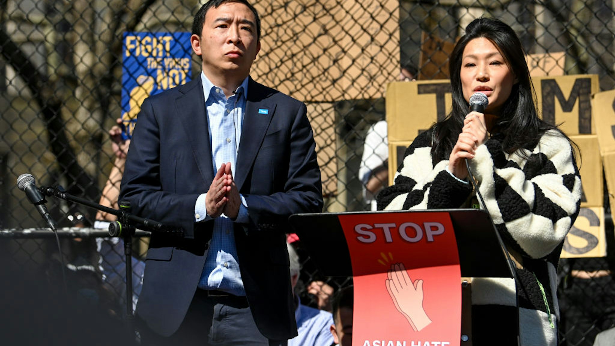NEW YORK, NEW YORK - MARCH 21: New York City Mayoral candidate Andrew Yang stands next to his wife, Evelyn Yang, while she speaks at the "Rally Against Hate" in Columbus Park, Chinatown on March 21, 2021 in New York City. Stop Asian Hate rallies have been happening in New York City and other parts of the country after a year of that has seen a rise in hate crimes towards Asian Americans and the attack in Atlanta, Georgia on March 16, 2021 that left eight people dead, including six Asian women.
