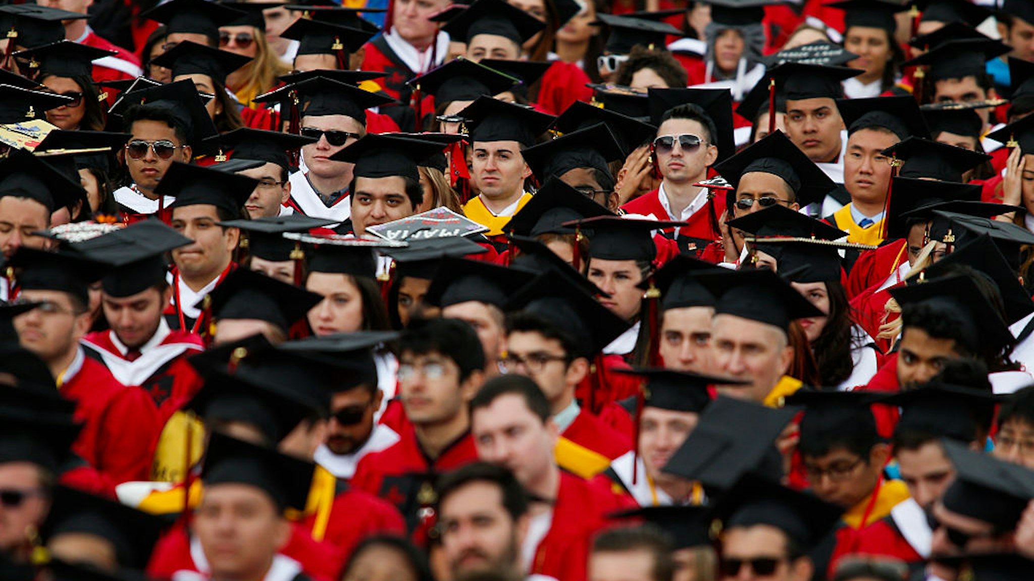 NEW BRUNSWICK, NJ - MAY 15: Students listen to U.S. President Barack Obama while he speaks after receiving an honorary doctorate of laws during the 250th anniversary commencement ceremony at Rutgers University on May 15, 2016 in New Brunswick, New Jersey. Obama is the first sitting president to speak at the school's commencement. (Photo by Eduardo Munoz Alvarez/Getty Images)