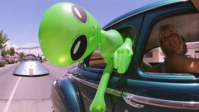 372049 02: An alien doll hangs out a car window in downtown Roswell, New Mexico July 1, 2000 as part of the annual UFO Encounter, which runs through July 4, 2000. The annual festival stems from a mysterious crash northwest of Roswell in 1947. The Army initially said it was a UFO crash, but quickly backed off that report. The Pentagon has since said it was a top-secret balloon crash, but UFO enthusiasts don''t believe that story, which gives rise to what has become known as the "Roswell Incident". (Photo by Joe Raedle/Newsmakers)372049 02: An alien doll hangs out a car window in downtown Roswell, New Mexico July 1, 2000 as part of the annual UFO Encounter, which runs through July 4, 2000. The annual festival stems from a mysterious crash northwest of Roswell in 1947. The Army initially said it was a UFO crash, but quickly backed off that report. The Pentagon has since said it was a top-secret balloon crash, but UFO enthusiasts don''t believe that story, which gives rise to what has become known as the "Roswell Incident". (Photo by Joe Raedle/Newsmakers)
