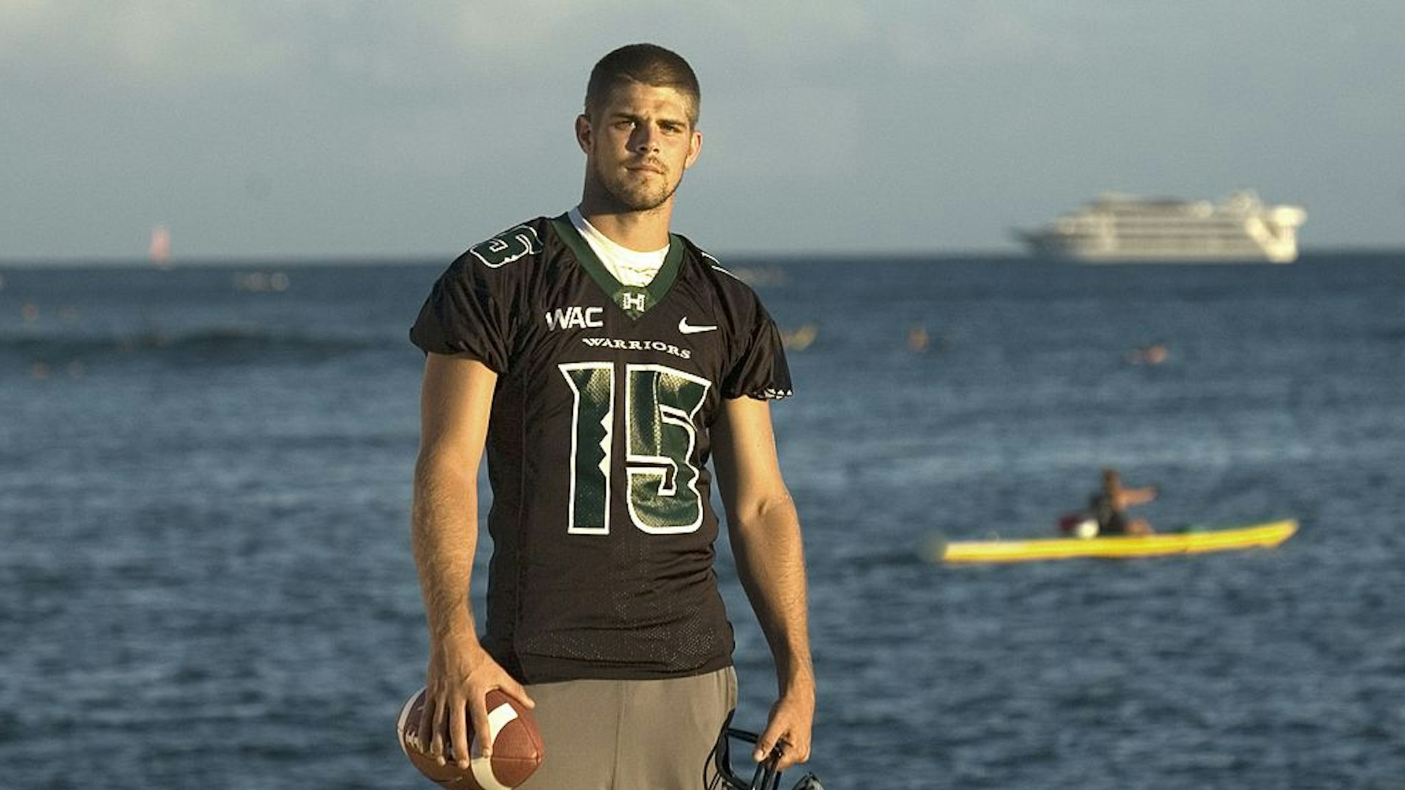 HONOLULU - AUGUST 16: Quarterback Colt Brennan or the University of Hawaii Warriors poses for a photo on Waikiki Beach on August 16, 2007 in Honolulu, Hawaii. (Photo by Lucy Pemoni/Getty Images)