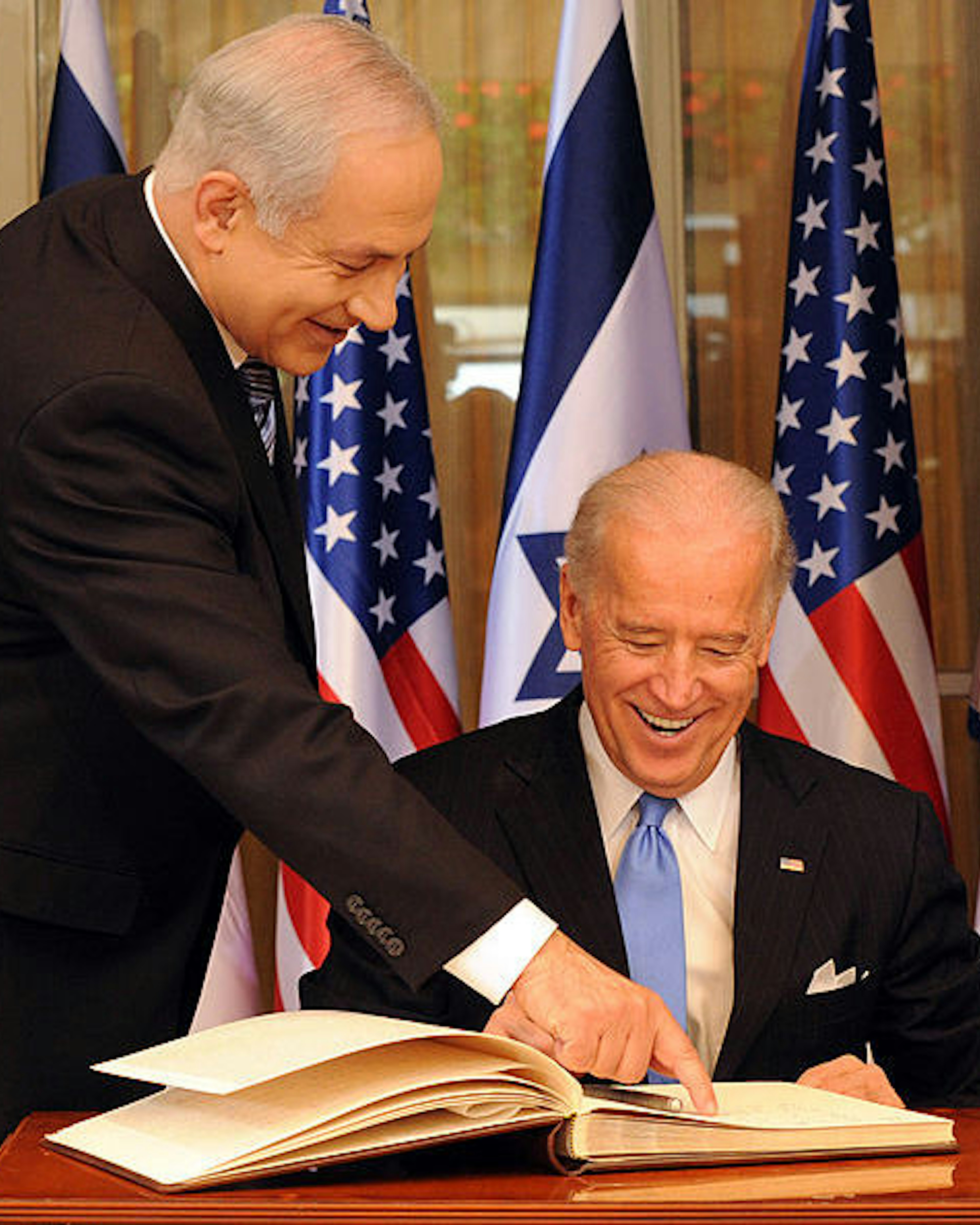 Israeli Prime Minister Benjamin Netanyahu helps US Vice President Joe Biden sign the guestbook at his residence in Jerusalem, March 9, 2010. UPI/Debbie Hill