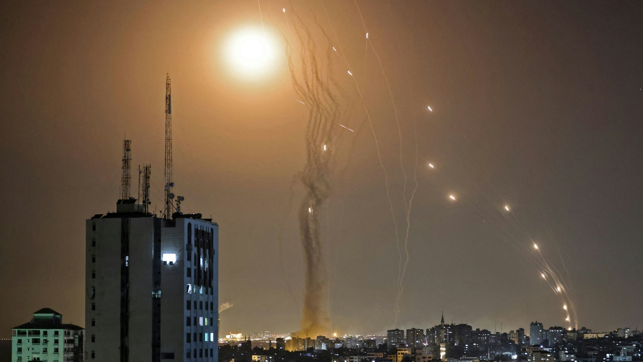 A rocket launched from Gaza city controlled by the Palestinian Hamas movement, is intercepted by Israel's Iron Dome aerial defence system, on May 11, 2021.