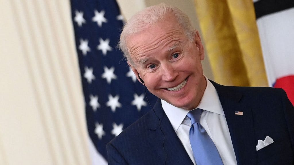 US President Joe Biden (R) and South Korean President Moon Jae-in participate in a press conference in the State Dining Room of the White House in Washington, DC on May 21, 2021.