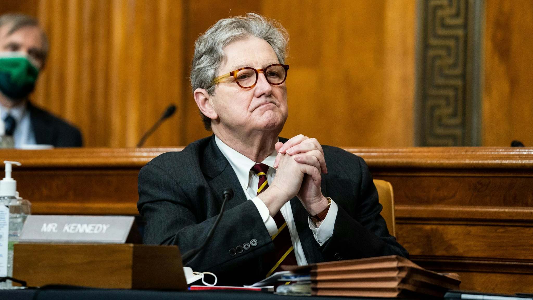 Senator John Kennedy, a Republican from Louisiana, listens during a Senate Budget Committee confirmation hearing for Neera Tanden, director of the Office and Management and Budget (OMB) nominee for U.S. President Joe Biden, in Washington, D.C., U.S., on Wednesday, Feb. 10, 2021. Tanden apologized for partisan tweets, pledged to distribute stimulus checks quickly, and defended her stance on Wall Street and Silicon Valley's influence in yesterday's hearing on her nomination to lead the OMB.