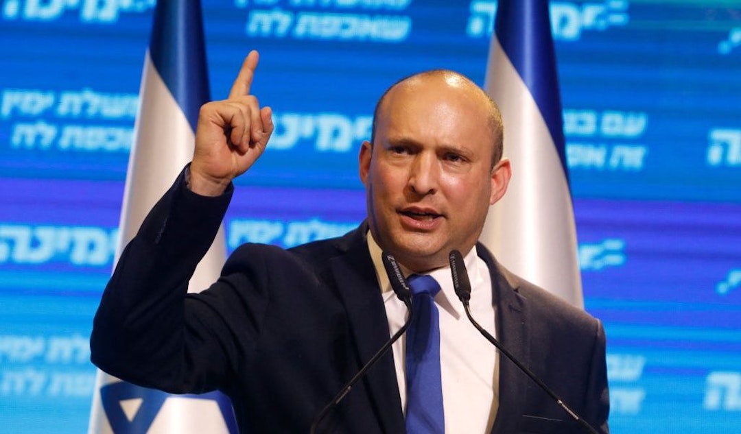 Naftali Bennett, leader of the Israeli right-wing Yamina ('New Right') party, addresses supporters at his party's campaign headquarters in the Mediterranean coastal city of Tel Aviv early on March 24, 2021, after the end of voting in the fourth national election in two years. (Photo by Gil COHEN-MAGEN / AFP) (Photo by GIL COHEN-MAGEN/AFP via Getty Images)
