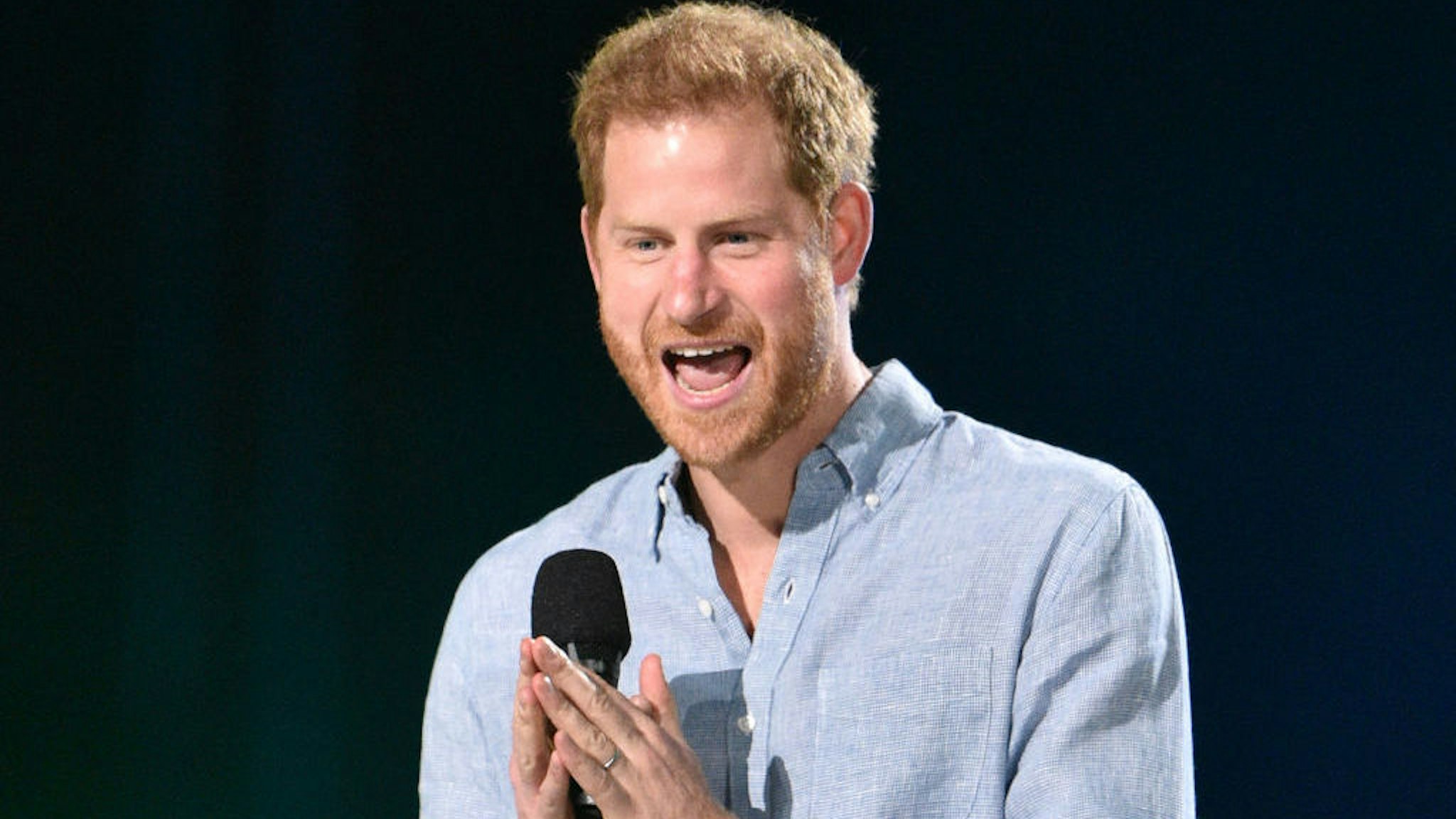 Co-Chair Britain's Prince Harry, Duke of Sussex, speaks onstage during the taping of the "Vax Live" fundraising concert at SoFi Stadium in Inglewood, California, on May 2, 2021. - The fundraising concert "Vax Live: The Concert To Reunite The World", put on by international advocacy organization Global Citizen, is pushing businesses to "donate dollars for doses," and for G7 governments to share excess vaccines. The concert will be pre-taped on May 2 in Los Angeles, and will stream on YouTube along with American television networks ABC and CBS on May 8. (Photo by VALERIE MACON / AFP) (Photo by VALERIE MACON/AFP via Getty Images)
