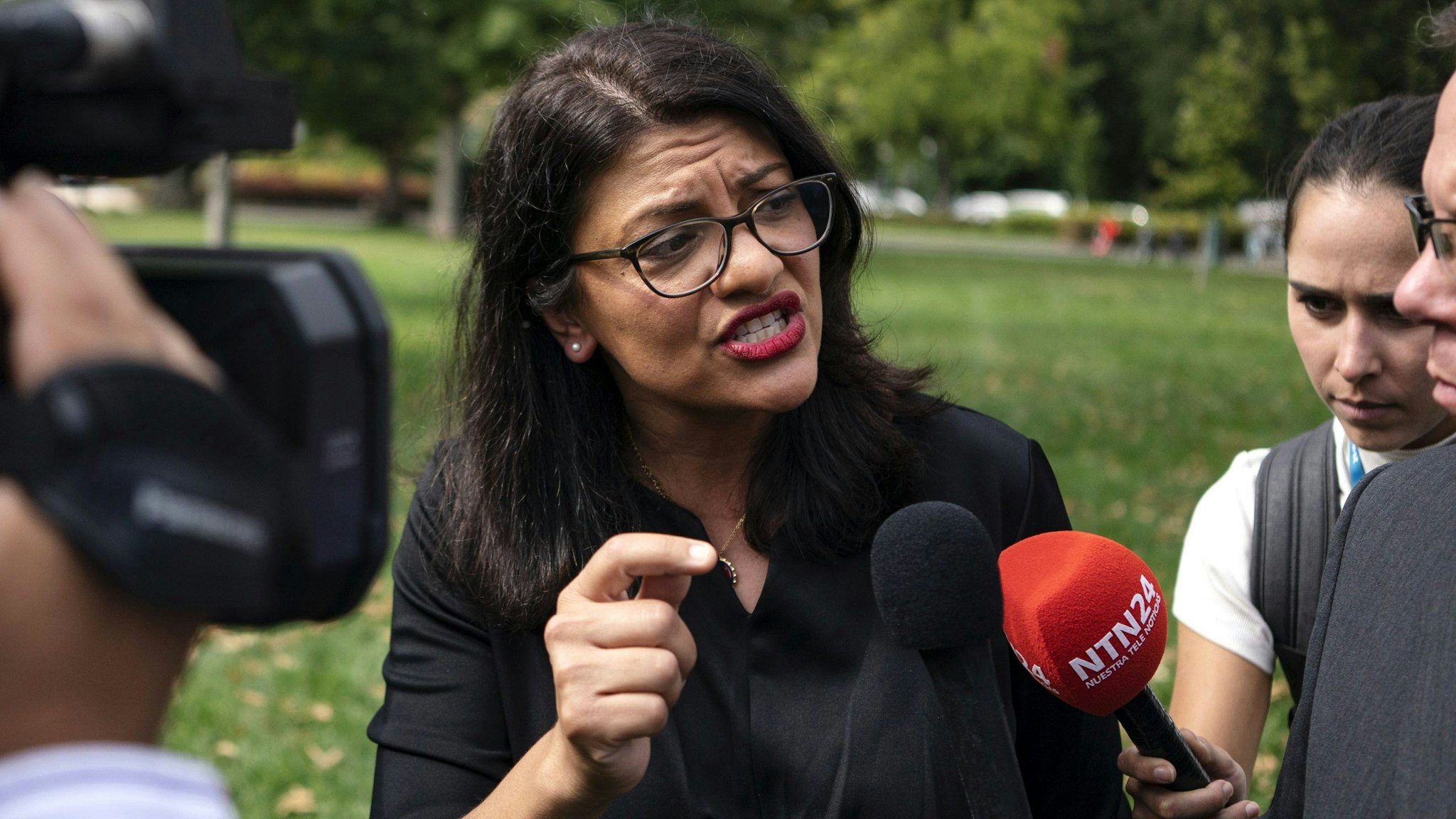 Representative Rashida Tlaib, a Democrat from Michigan, speaks with members of the media following a rally held in support of impeaching U.S. President Donald Trump in Washington, D.C., U.S., on Thursday, Sept. 26, 2019. House Speaker Nancy Pelosi announced that the House would begin an impeachment inquiry against Trump related to a whistle-blower complaint alleging troubling interactions between Trump and the president of Ukraine.