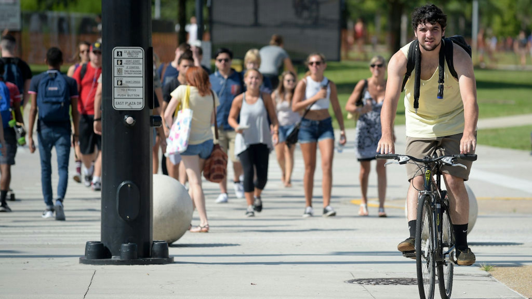 Students make their way across campus on the first day of classes for the fall semester at the University of Central Florida in Orlando, Fla., Monday, Aug. 24, 2015.