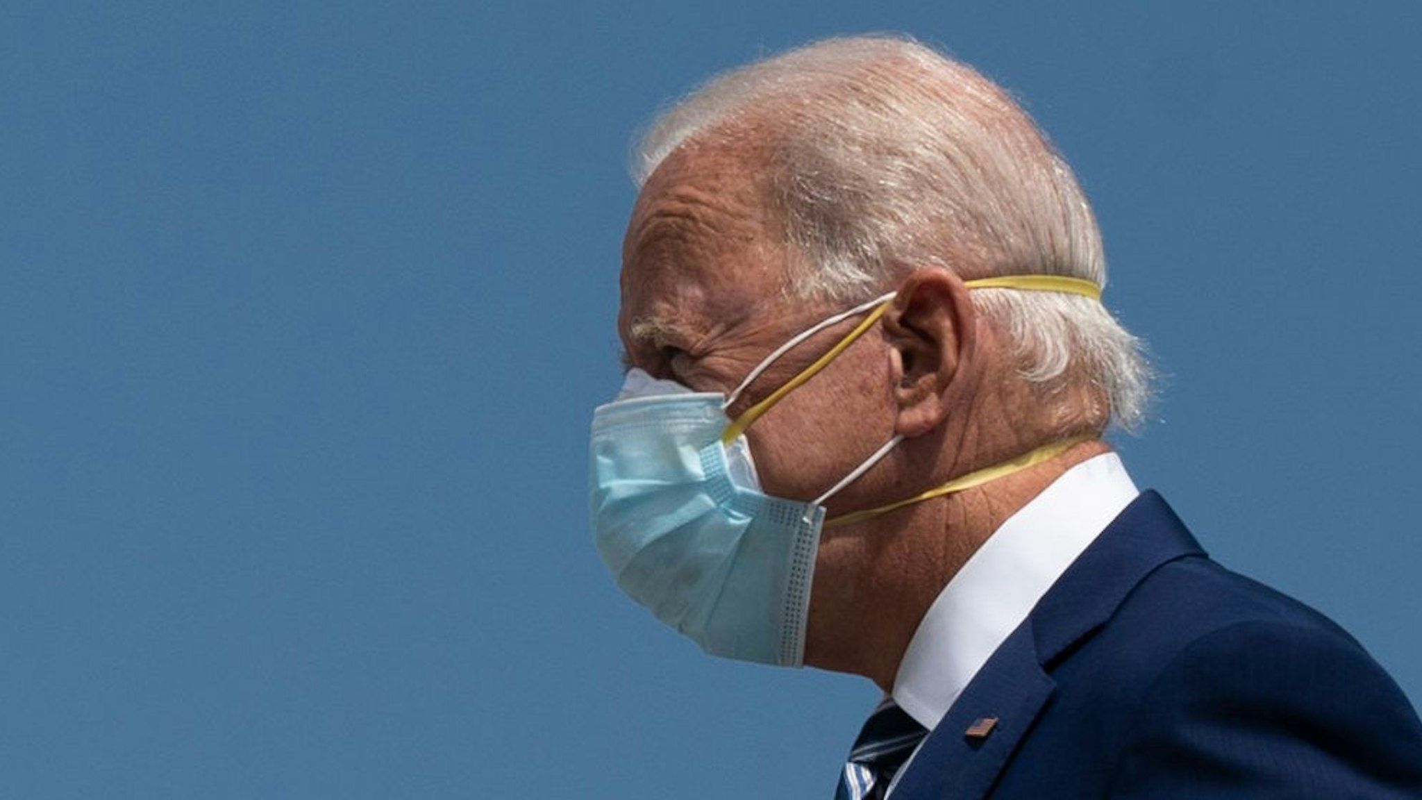 Democratic Presidential Candidate Joe Biden wears two masks as he arrives in Fort Lauderdale, Florida on October 13, 2020. - Joe Biden headed for Florida on Tuesday to court elderly Americans who helped elect Donald Trump four years ago but appear to be swinging to the Democratic candidate for the White House this time around amid the coronavirus pandemic. Biden, at 77 the oldest Democratic nominee ever, is to "deliver his vision for older Americans" at an event in the city of Pembroke Pines, north of Miami, his campaign said. (Photo by JIM WATSON / AFP) (Photo by