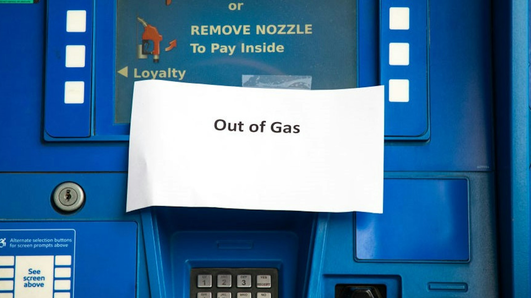 Notes are left on gas pumps to let motorists know the pumps are empty at an Exxon gas station in Charlotte, North Carolina on May 12, 2021. - Fears the shutdown of the Colonial Pipeline because of a cyberattack would cause a gasoline shortage led to some panic buying and prompted US regulators on May 11, 2021 to temporarily suspend clean fuel requirements in three eastern states and the nation's capital. (Photo by Logan Cyrus / AFP) (Photo by