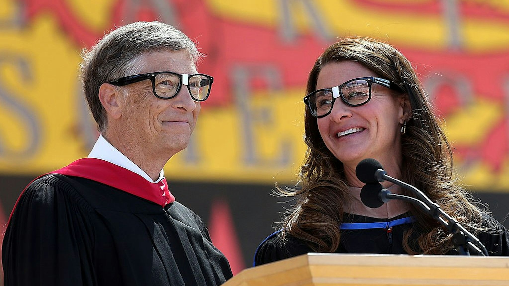 STANFORD, CA - JUNE 15: Microsoft founder and chairman Bill Gates shares the stage with his wife Melinda during the 123rd Stanford commencement ceremony June 15, 2014 in Stanford, California. Bill Gates and wife Melinda Gates delivered the commencement speech to Stanford University graduates. (Photo by