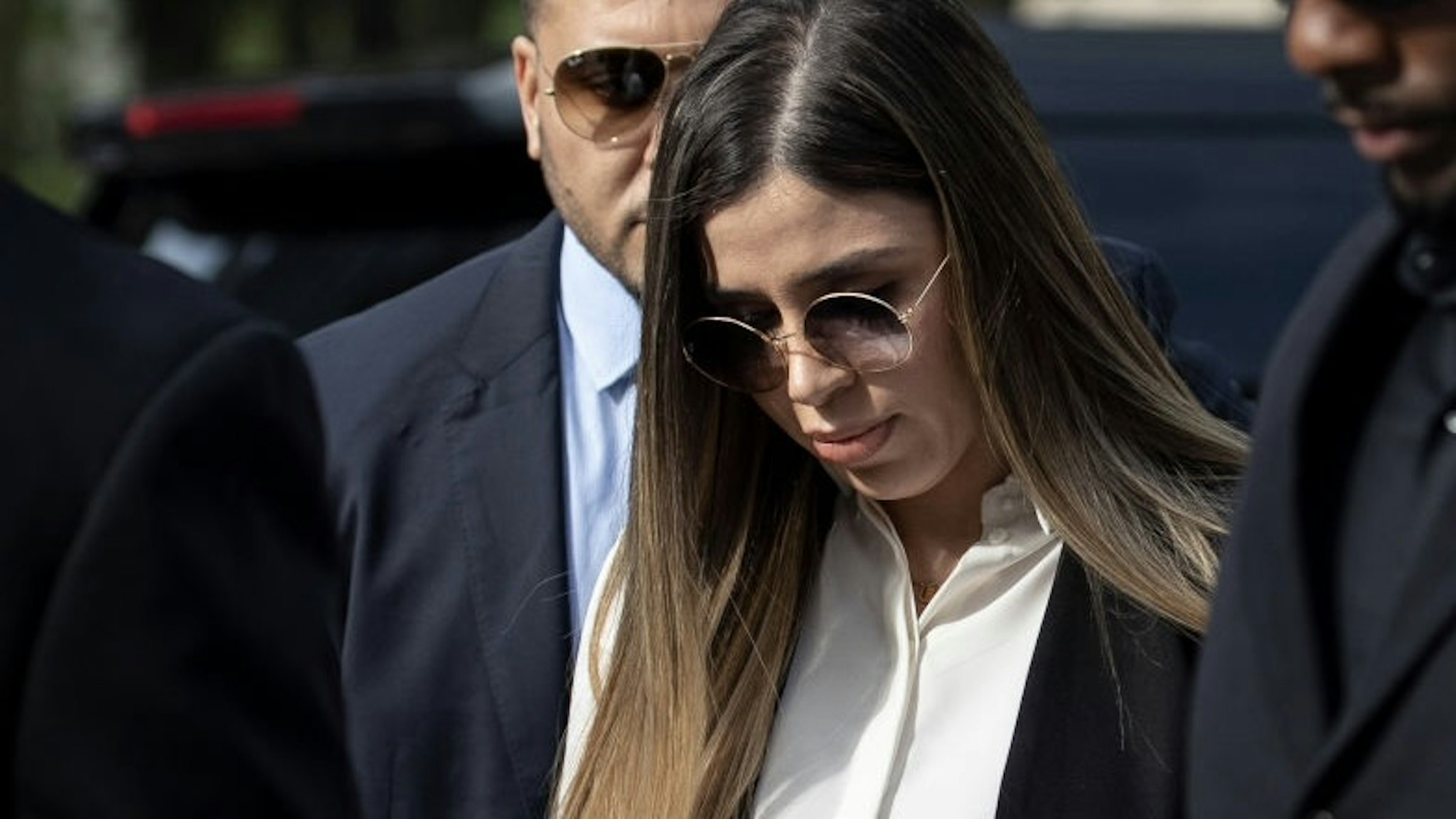 Mexican Drug Lord El Chapo Sentenced In New York NEW YORK, NY - JULY 17: Emma Coronel Aispuro, wife of Joaquin "El Chapo" Guzman, is surrounded by security as she arrives at federal court on July 17, 2019 in New York City. El Chapo was found guilty on all charges in a drug conspiracy trial and will be sentenced this morning. (Photo by Drew Angerer/Getty Images) Drew Angerer / Staff via Getty Images