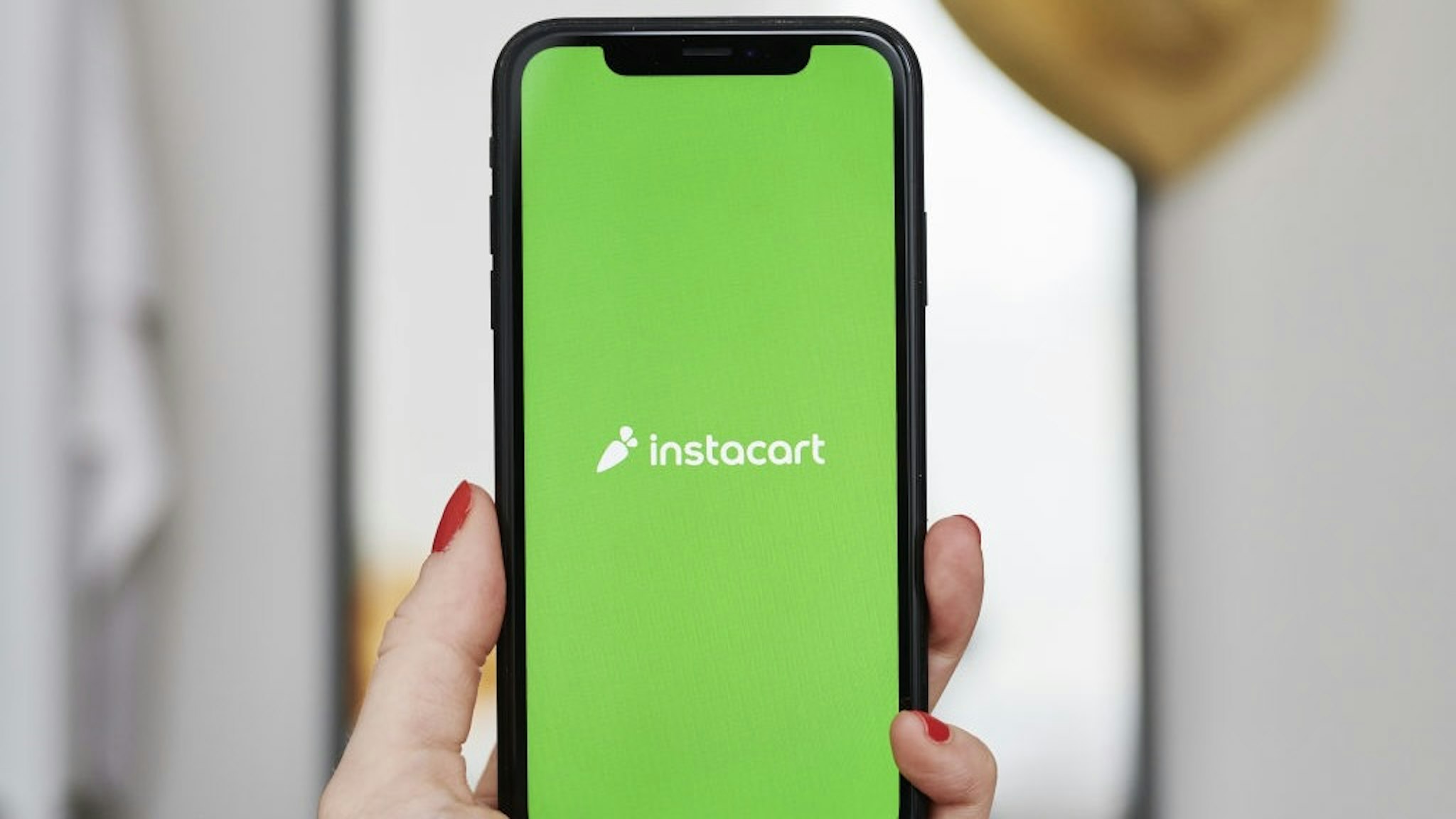 Apps Take Center Stage Amid Shelter-In-Place Covid-19 Guidelines The logo for the Instacart Inc. application is displayed on an Apple Inc. iPhone in an arranged photograph taken in the Brooklyn borough of New York, U.S., on Friday, April 10, 2020. Across the country, millions of consumers are turning to Instacart and other services to fill their fridges via online delivery rather than brave going to a supermarket because of shelter-in-place declarations during the coronavirus pandemic. Photographer: Gabby Jones/Bloomberg via Getty Images Bloomberg / Contributor via Getty Images