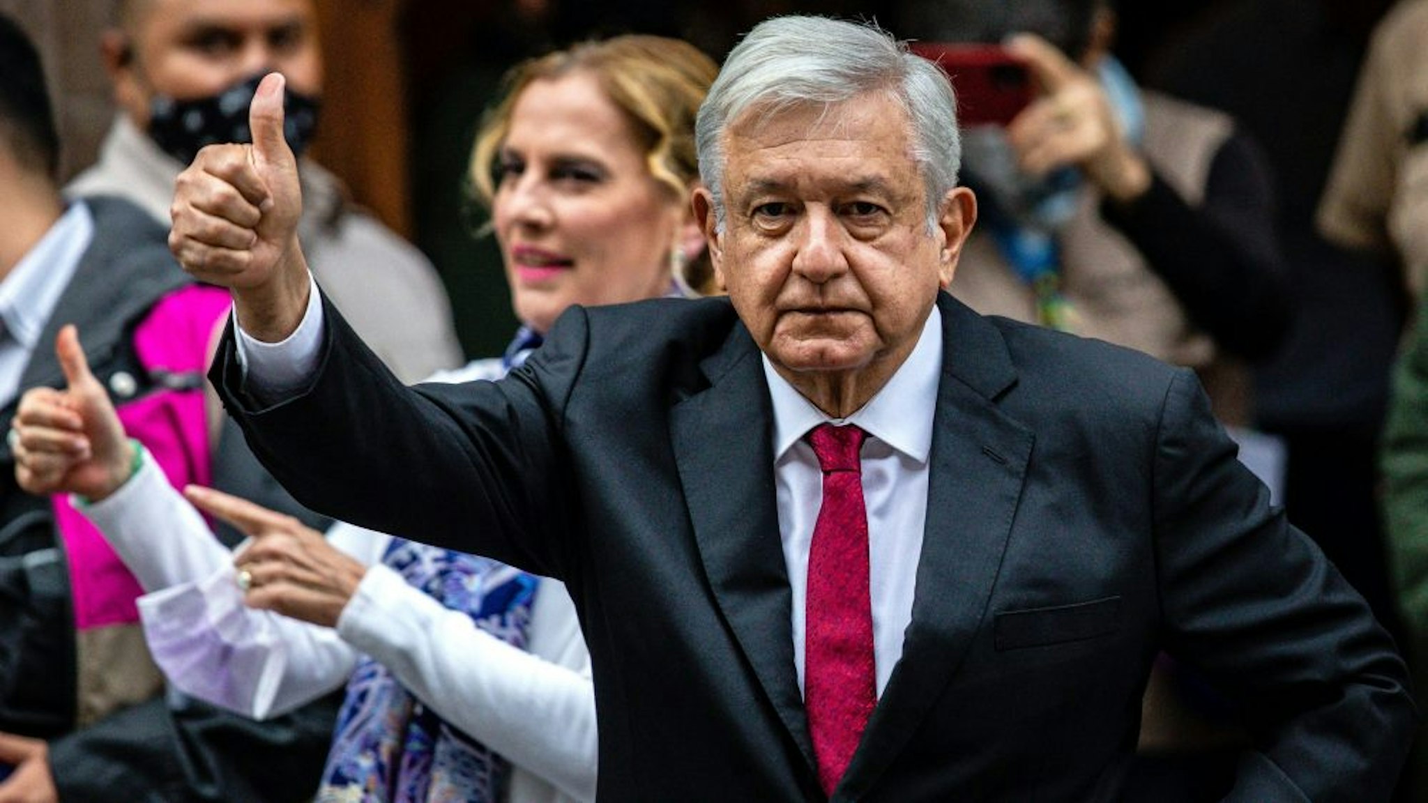 MEXICO CITY, MEXICO - JUNE 06: President of Mexico Andres Manuel Lopez Obrador gives a thumb up after voting at the polling place on June 06, 2021 in Mexico City, Mexico. A record number of 93.5 million citizens are able to vote today in the largest election in the country's history. 500 deputies, governors in 15 states and 20,000 local authorities will be elected. During the campaign, 35 candidates were reported murdered.