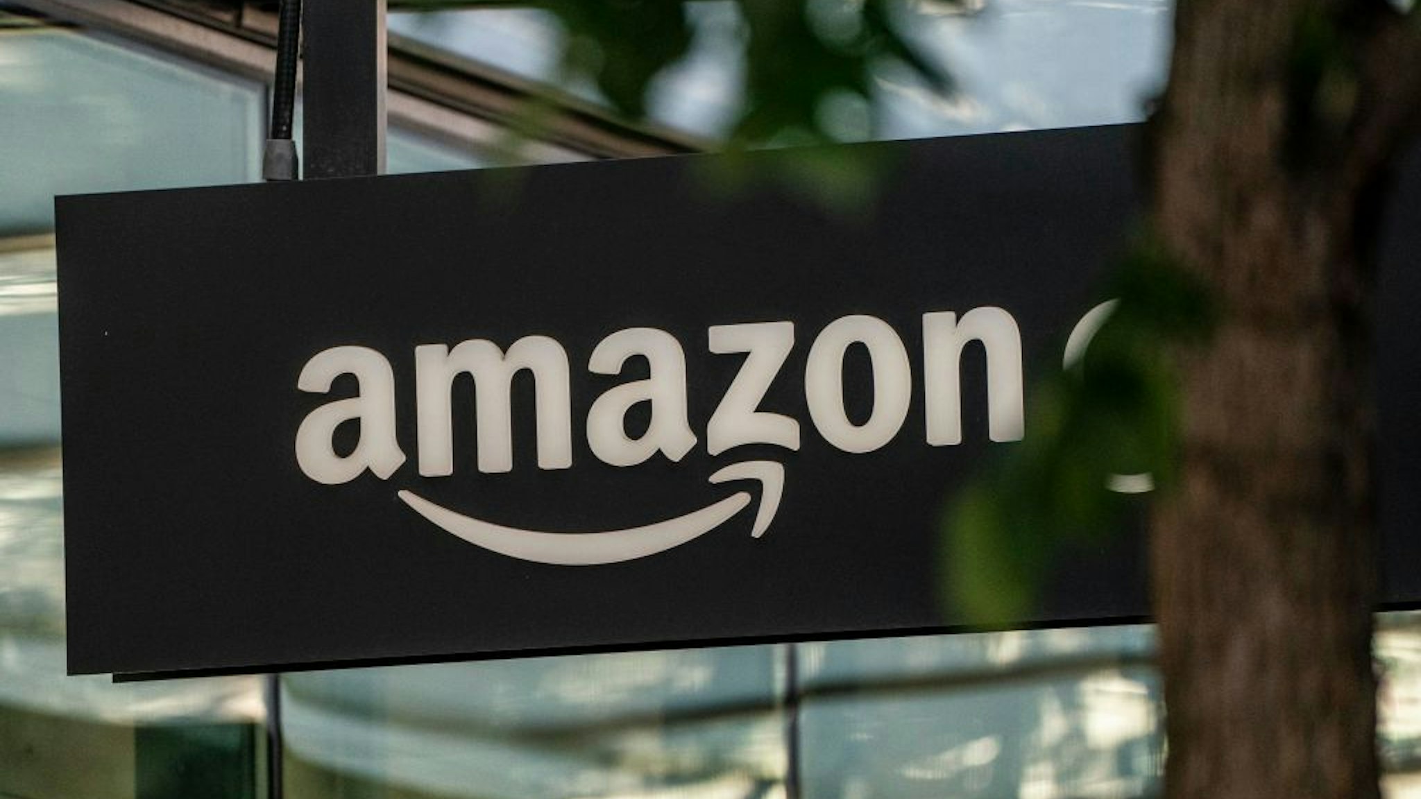 SEATTLE, WA - MAY 20: A sign is seen outside of an Amazon Go store at the Amazon.com Inc. headquarters on May 20, 2021 in Seattle, Washington. Five women employees sued Amazon this week, alleging discrimination and retaliation.