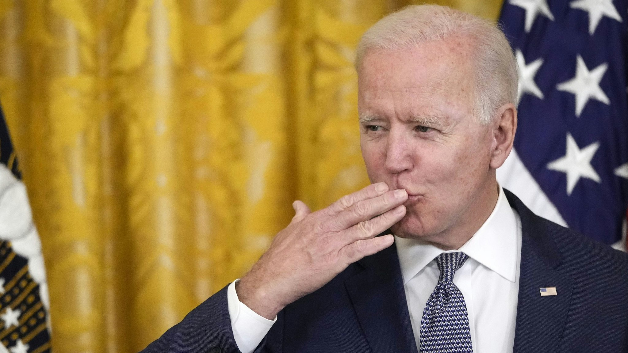WASHINGTON, DC - JUNE 17: U.S. President Joe Biden blows a kiss to the audience before signing the Juneteenth National Independence Day Act into law in the East Room of the White House on June 17, 2021 in Washington, DC. The Juneteenth holiday marks the end of slavery in the United States and the Juneteenth National Independence Day will become the 12th legal federal holiday — the first new one since Martin Luther King Jr. Day was signed into law in 1983.