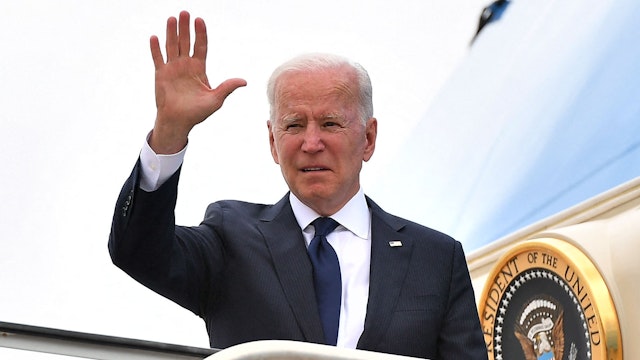 US President Joe Biden boards Air Force One before departing from Tulsa International Airport in Tulsa, Oklahoma, on June 1, 2021. - US President Joe Biden traveled Tuesday to Oklahoma to honor the victims of a 1921 racial massacre in the city of Tulsa, where African American residents are hoping he will hear their call for financial reparations 100 years on.