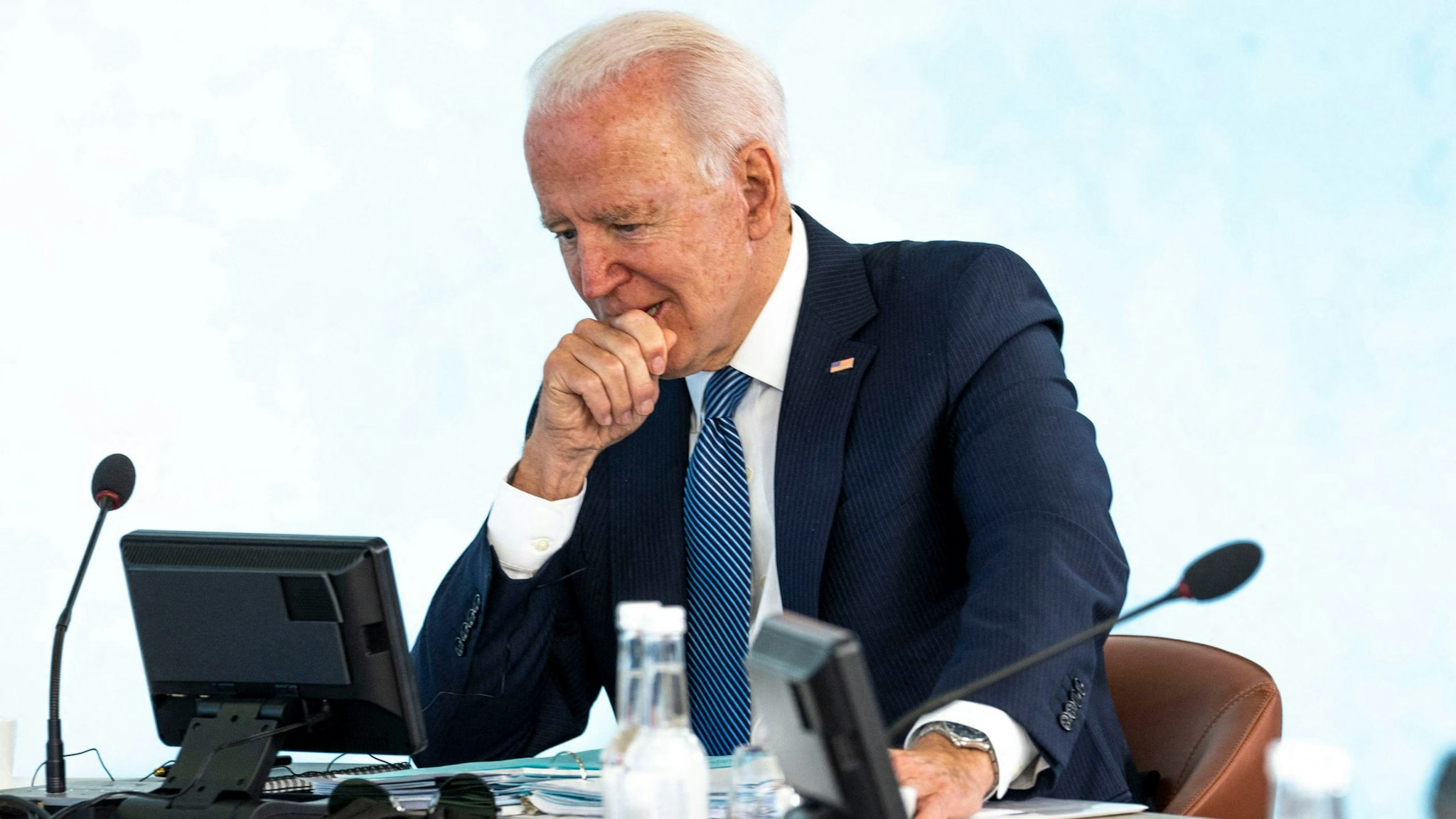 US President Joe Biden (L) and France's President Emmanuel Macron attend a plenary session at the G7 summit in Carbis Bay, Cornwall on June 13, 2021.