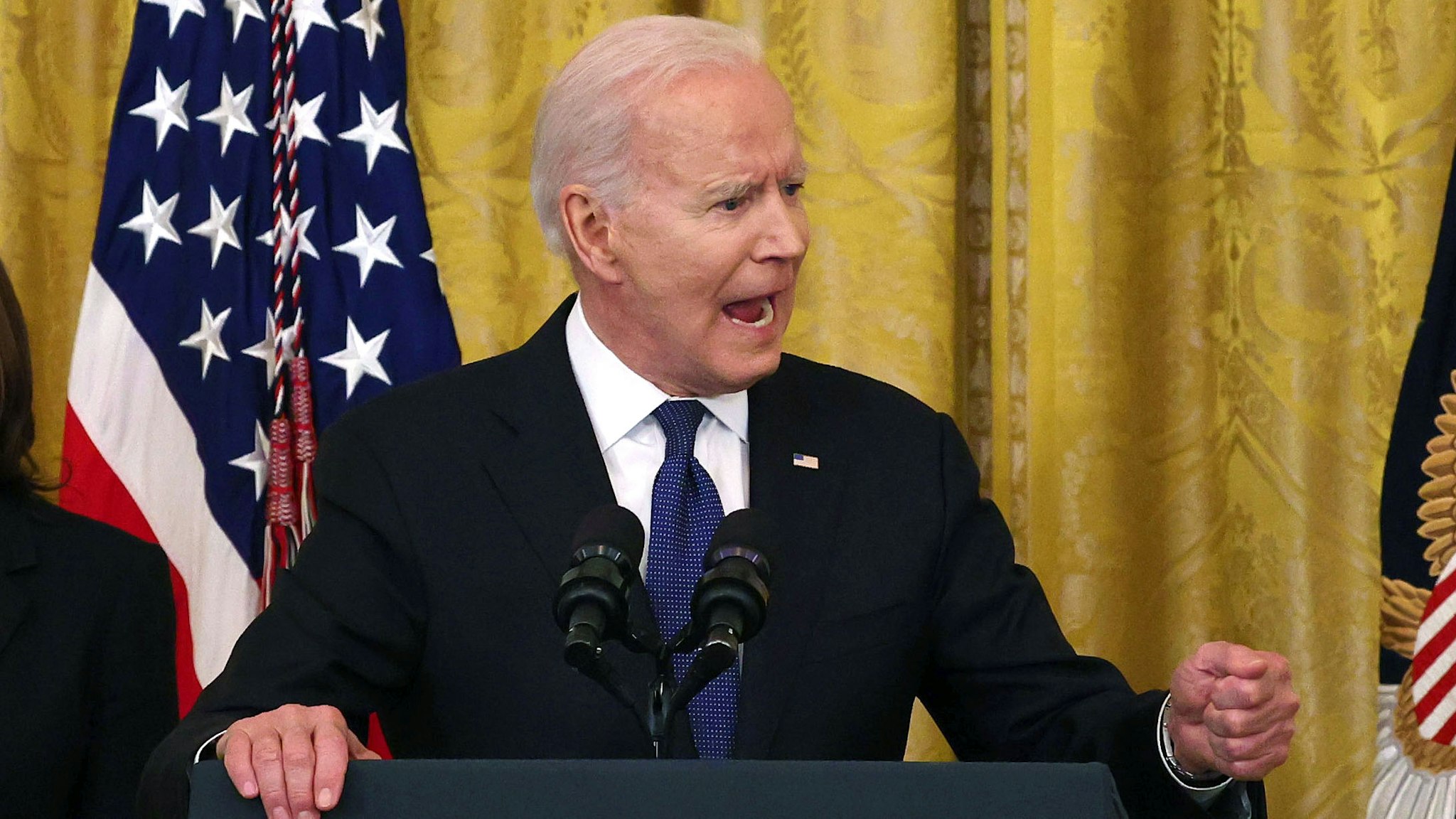 WASHINGTON, DC - MAY 20: U.S. President Joe Biden gestures as he delivers remarks, before a signing ceremony for the COVID-19 Hate Crimes Act in the East Room of the White House on May 20, 2021 in Washington, DC.  The legislation, drafted in response to the increased violence against the Asian American and Pacific Islander (AAPI) community during the Coronavirus pandemic, will create a new position in the Department of Justice to focus on the rise in hate crimes and provide resources to federal, state, and local jurisdictions to better report cases.