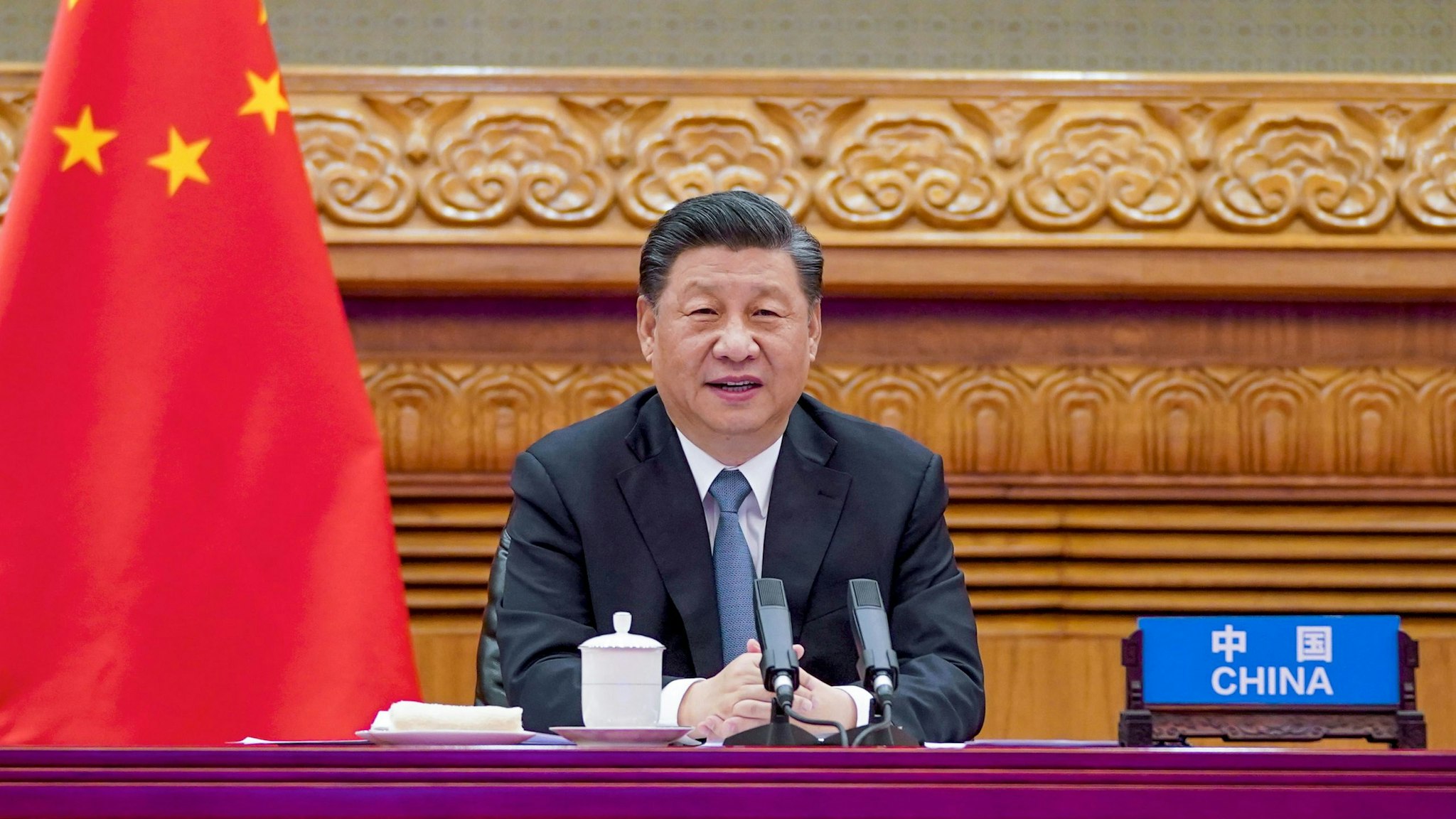 BEIJING, April 16, 2021 -- Chinese President Xi Jinping attends a video summit with French President Emmanuel Macron and German Chancellor Angela Merkel in Beijing, capital of China, April 16, 2021.