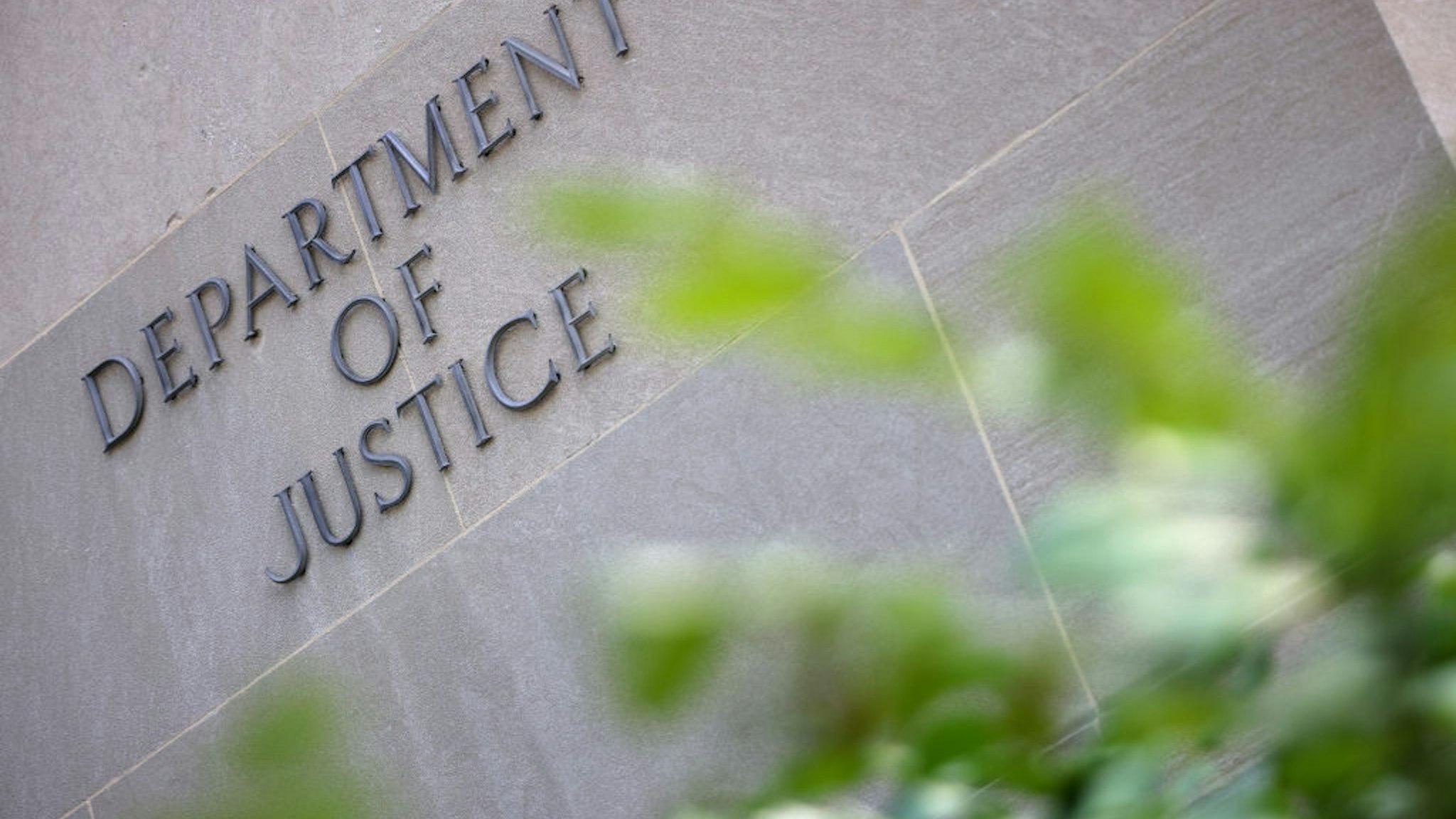WASHINGTON, DC - JUNE 14: A sign at the U.S. Department of Justice is seen on June 14, 2021 in Washington, DC. U.S. Attorney General is expected to meet with media executives, including members of CNN, The New York Times and The Washington Post, after Trump's Justice Department attempted to obtain email and phone records from journalists.