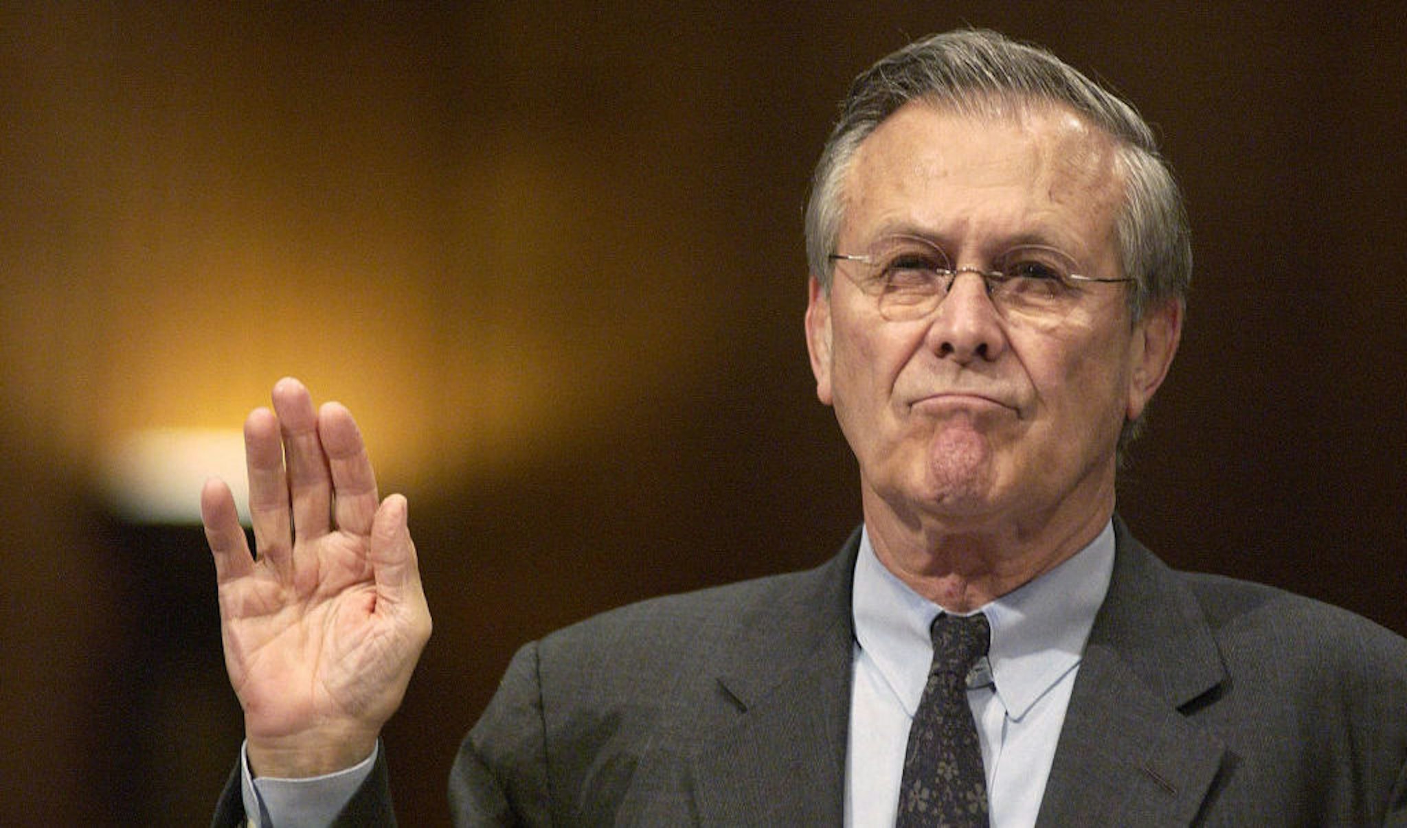 US Secretary of Defense Donald Rumsfeld is sworn in before the Senate Armed Services Committee in Washington, DC before testifying on abuses at a military prison in Iraq on May 7, 2004. Donald Rumsfeld, the defense secretary who became the face of U.S. foreign policy under President George W. Bush while the administration’s troop deployments toppled hostile regimes in Afghanistan and Iraq, has died on June 30, 2021.. He was 88. Photographer: Jay Mallin / Bloomberg