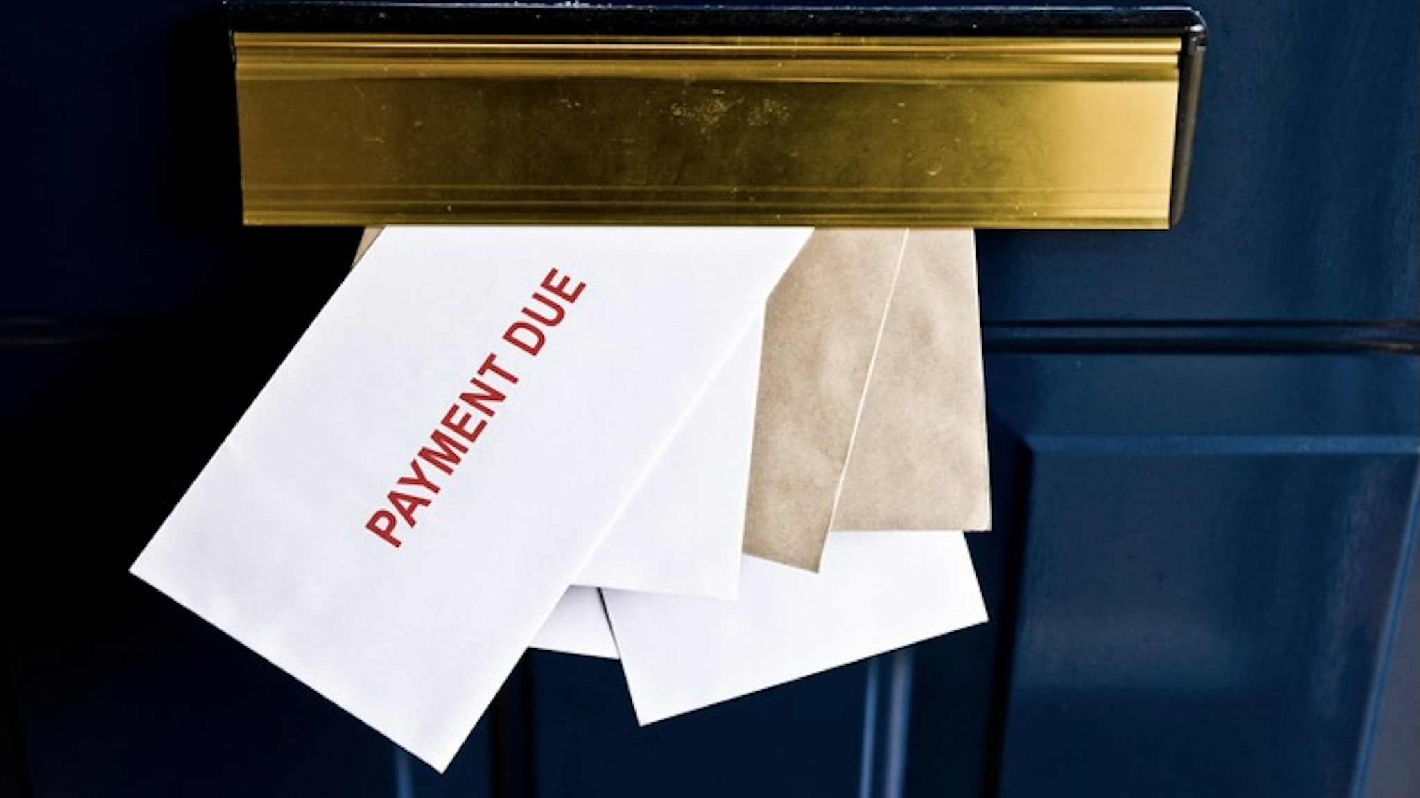 Payment due - stock photo Letters in letterbox saying payment due SEAN GLADWELL via Getty Images
