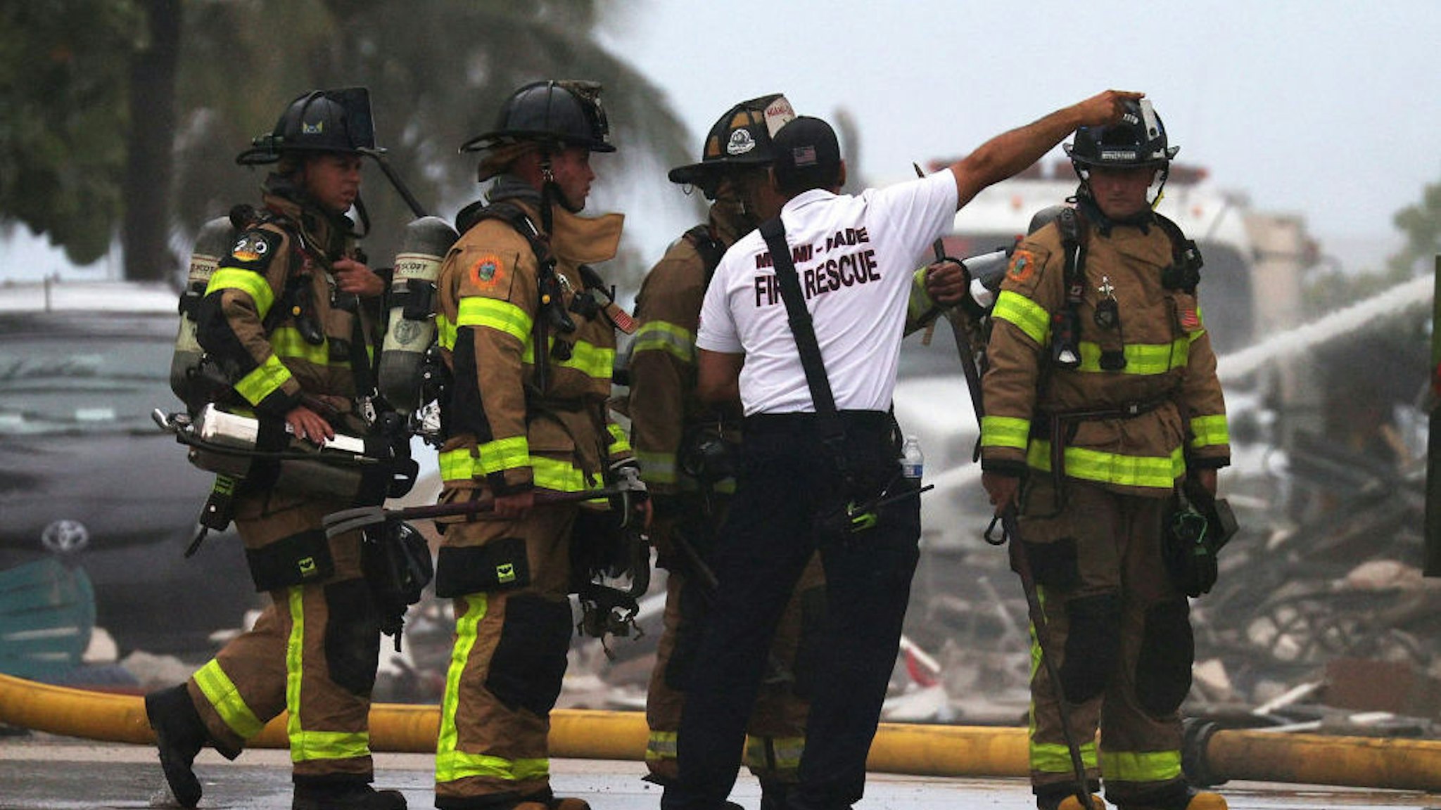 SURFSIDE, FLORIDA - JUNE 24: Miami-Dade Fire Rescue personnel continue search and rescue operations at the 12-story Champlain Towers South condo building that partially collapsed on June 24, 2021 in Surfside, Florida. It is unknown at this time how many people were injured as search-and-rescue effort continues with rescue crews from across Miami-Dade and Broward counties. According to reports, almost 100 people are still unaccounted for.