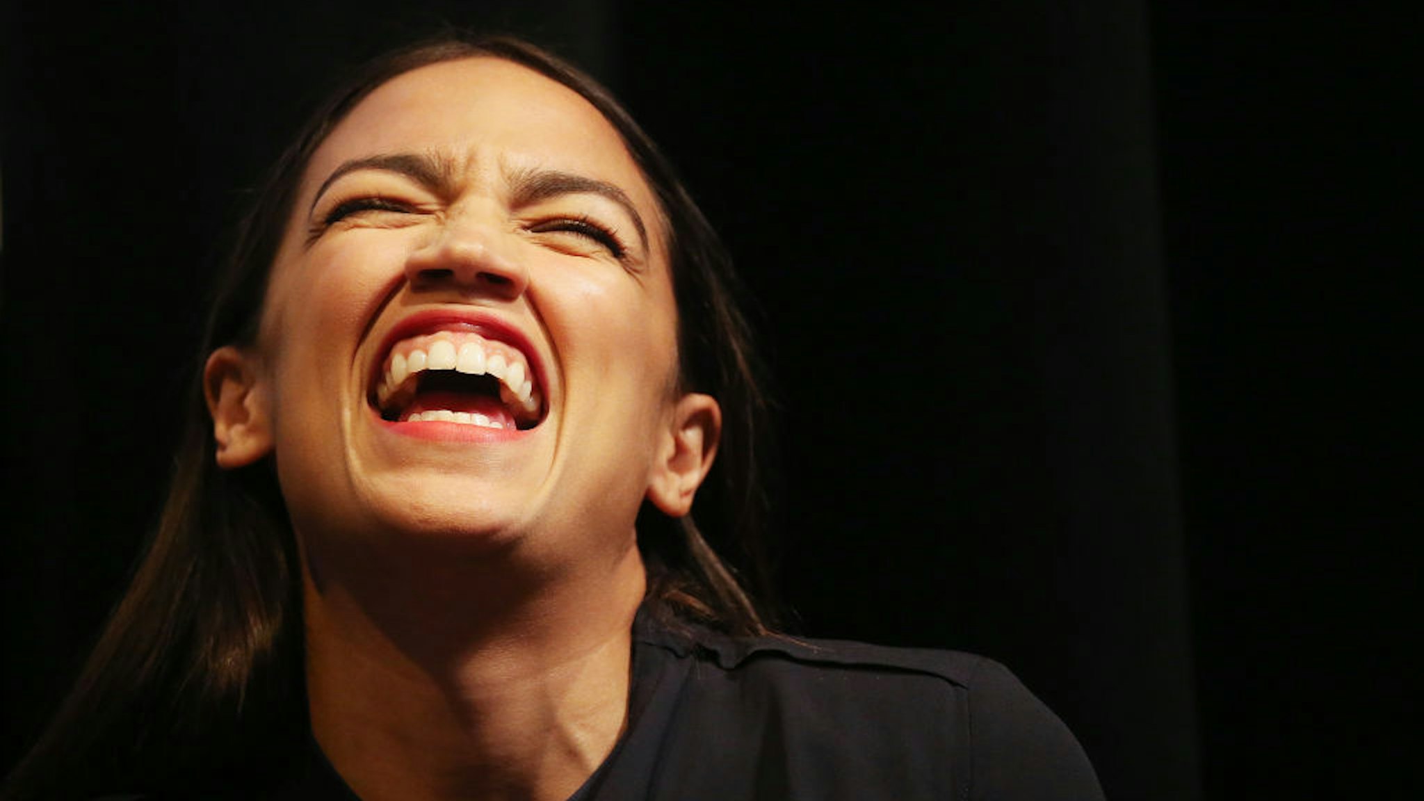 New York U.S. House candidate Alexandria Ocasio-Cortez laughs at a progressive fundraiser on August 2, 2018 in Los Angeles, California.