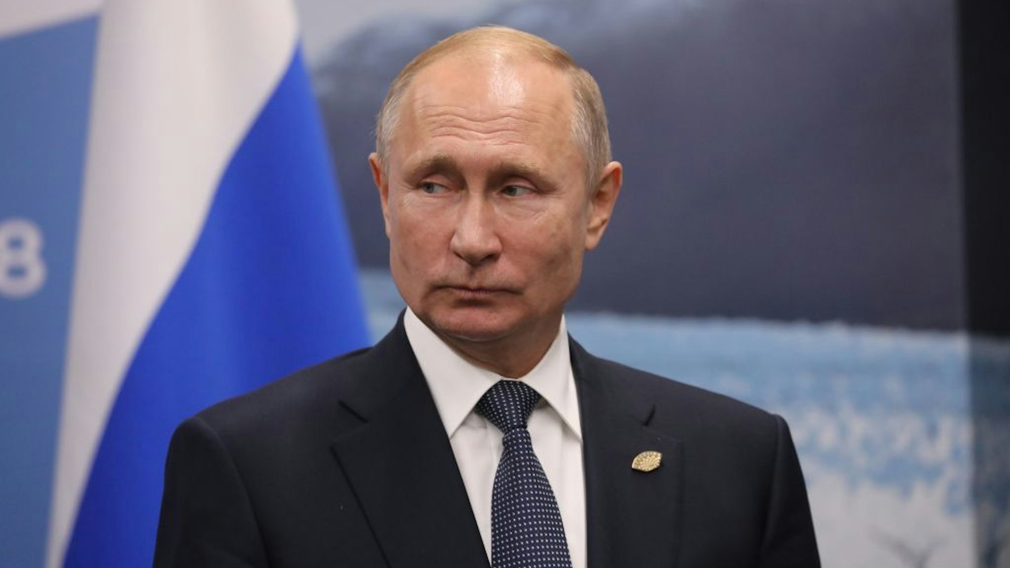 Russia's President Vladimir Putin gestures during a meeting with France's President Emmanuel Macron (out of frame) in the sidelines of the G20 Leaders' Summit in Buenos Aires, on November 30, 2018. - Global leaders gather in the Argentine capital for a two-day G20 summit beginning on Friday likely to be dominated by simmering international tensions over trade. (Photo by Ludovic MARIN / AFP) (Photo credit should read LUDOVIC MARIN/AFP via Getty Images)
