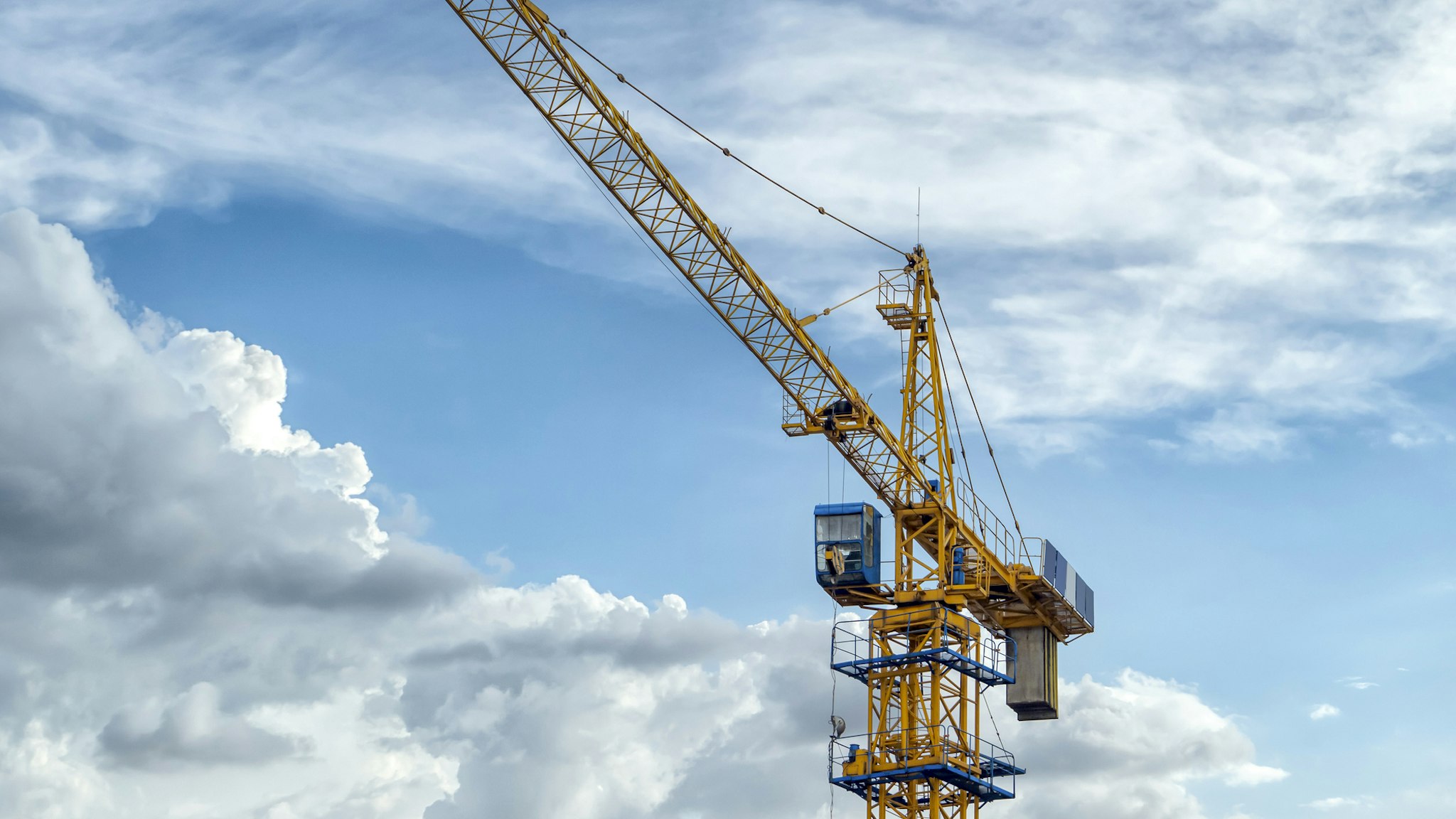 Crane on construction site - stock photo