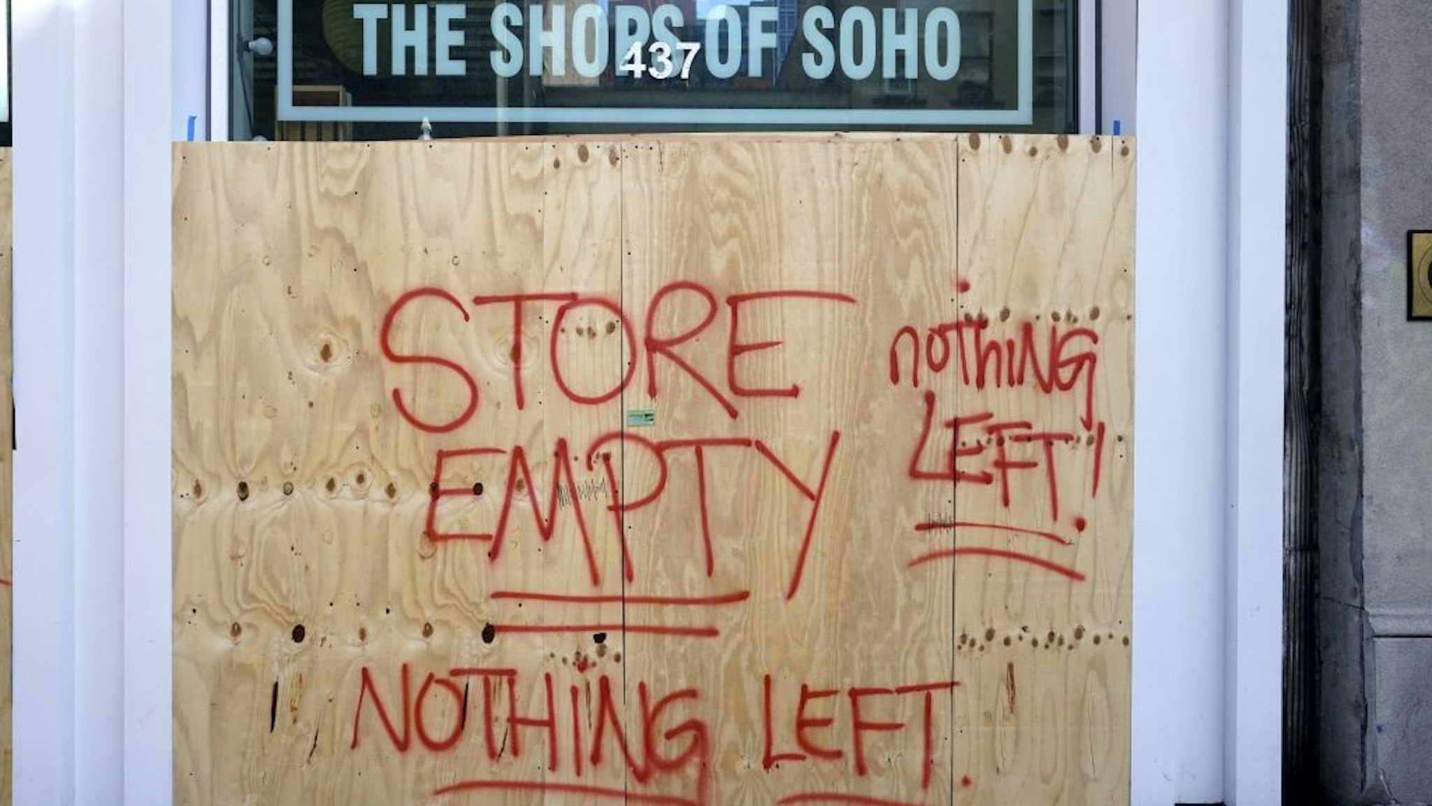 The Shoes of Soho store is seen boarded up on June 8, 2020 after rampant open looting and vandalism in New York, following the Minneapolis police killing of George Floyd.