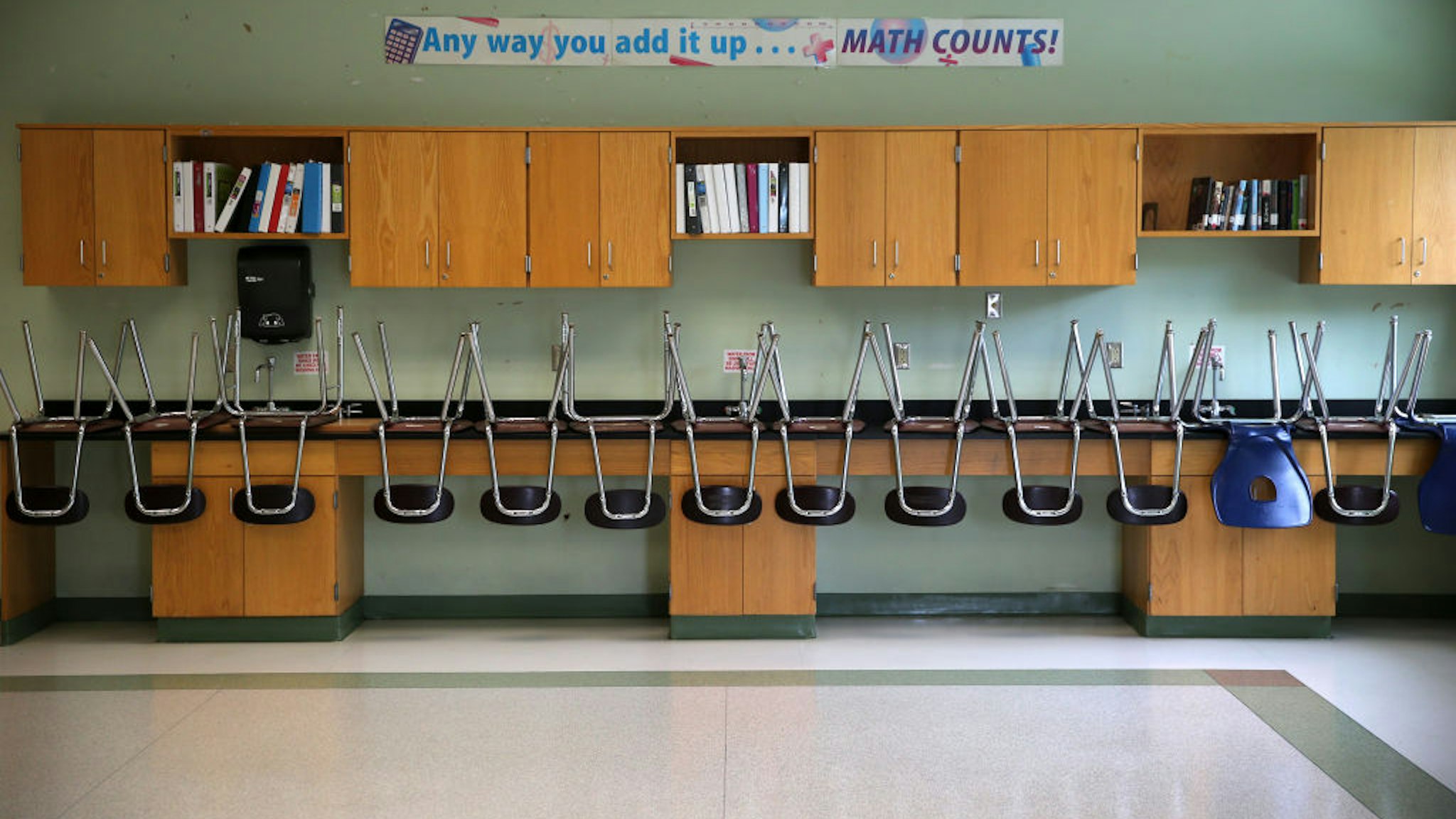 BOSTON - JULY 11: A finished clean room with stacked chairs in the science room at the Mildred Avenue K-8 School building in Boston's Mattapan, which were being cleaned for the reopening of school on July 9, 2020. Many measures are being taken by school systems to keep students safe from the COVID-19 pandemic including placing social distancing markers on the floors, increasing hand sanitizer stations, and increased cleaning. (Photo by David L. Ryan/The Boston Globe via Getty Images)
