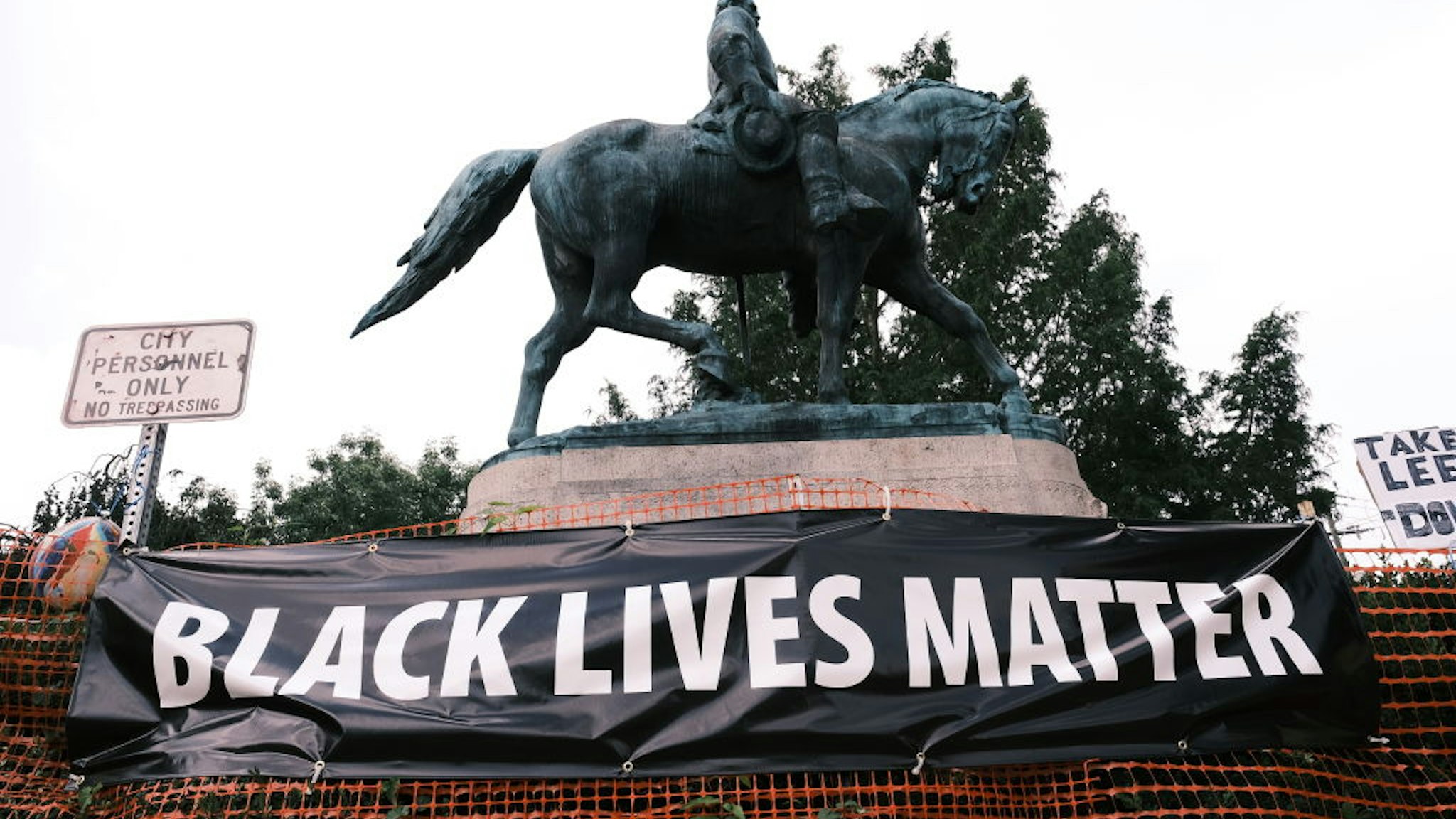 CHARLOTTESVILLE, VA - AUGUST 12: The statue of Robert E Lee with a banner that reads "Black Lives Matter" during the "Reclaim the Park" gathering at Emancipation Park on August 12, 2020 in Charlottesville, Virginia. Community members in Charlottesville collaborated with Congregate Cville and other Charlottesville organizations to put together the "Reclaim the Park" gathering to mark the third anniversary of a far-right rally on August 12, 2017.