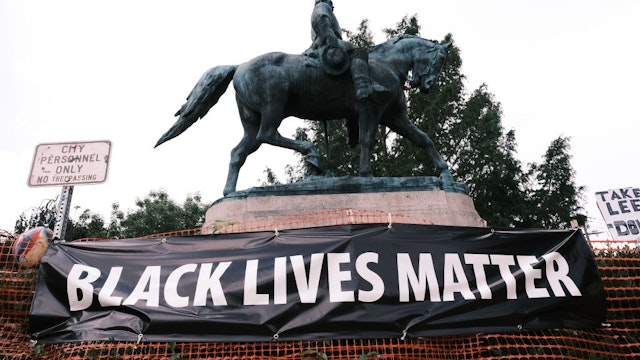 CHARLOTTESVILLE, VA - AUGUST 12: The statue of Robert E Lee with a banner that reads "Black Lives Matter" during the "Reclaim the Park" gathering at Emancipation Park on August 12, 2020 in Charlottesville, Virginia. Community members in Charlottesville collaborated with Congregate Cville and other Charlottesville organizations to put together the "Reclaim the Park" gathering to mark the third anniversary of a far-right rally on August 12, 2017.