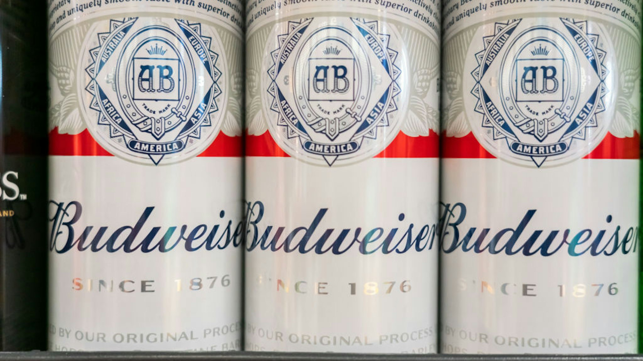 Cans of Budweiser beer seen at a supermarket.